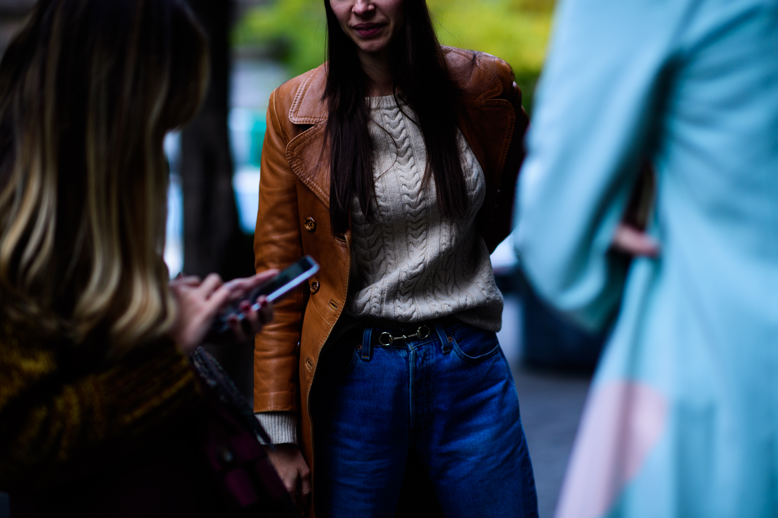 Model wearing brown leather coat