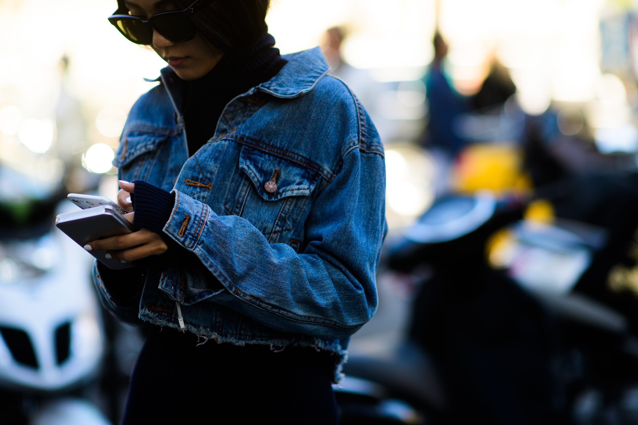 Woman in denim jacket