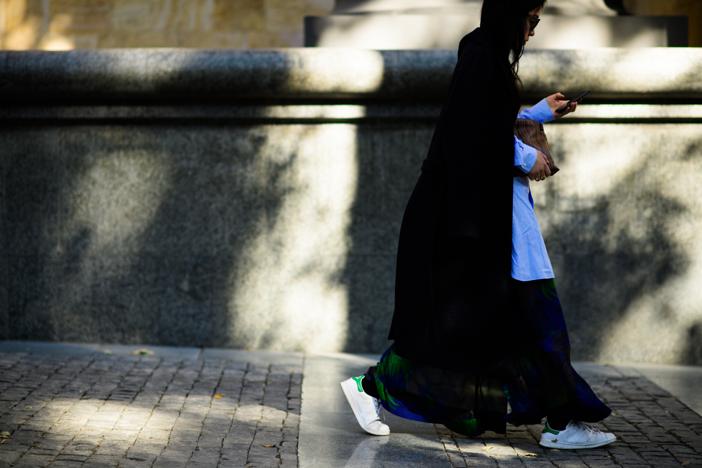 Woman with Loewe clutch