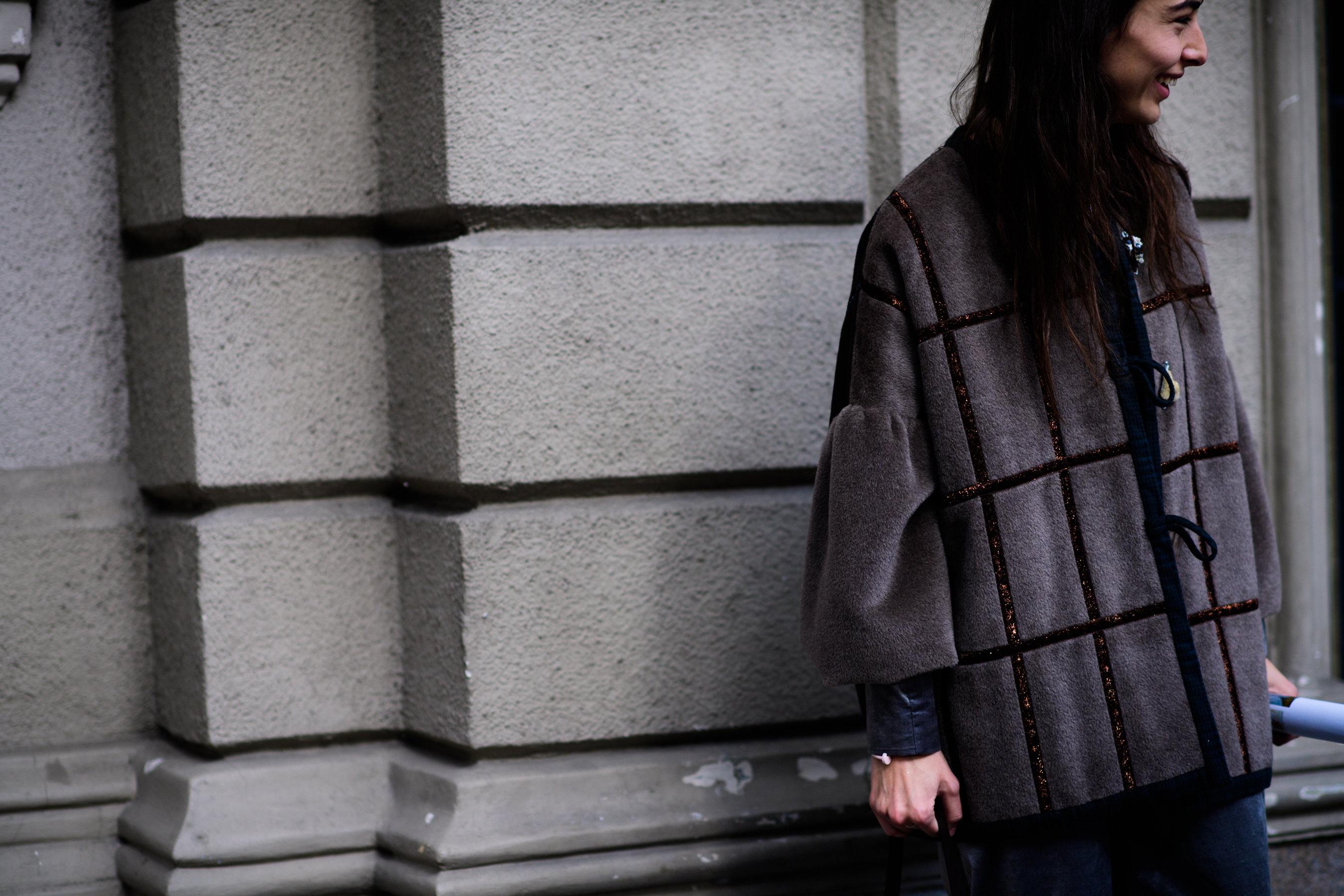 Georgian buyer wearing brown coat