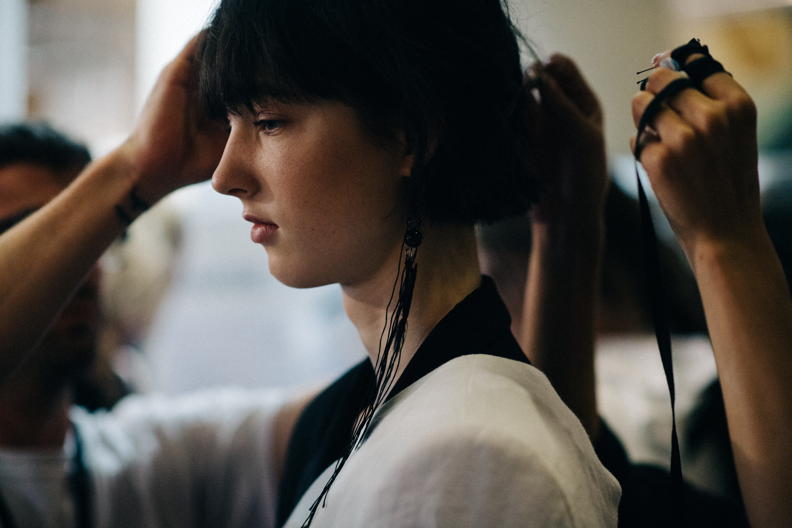 Model preparing hair for the show