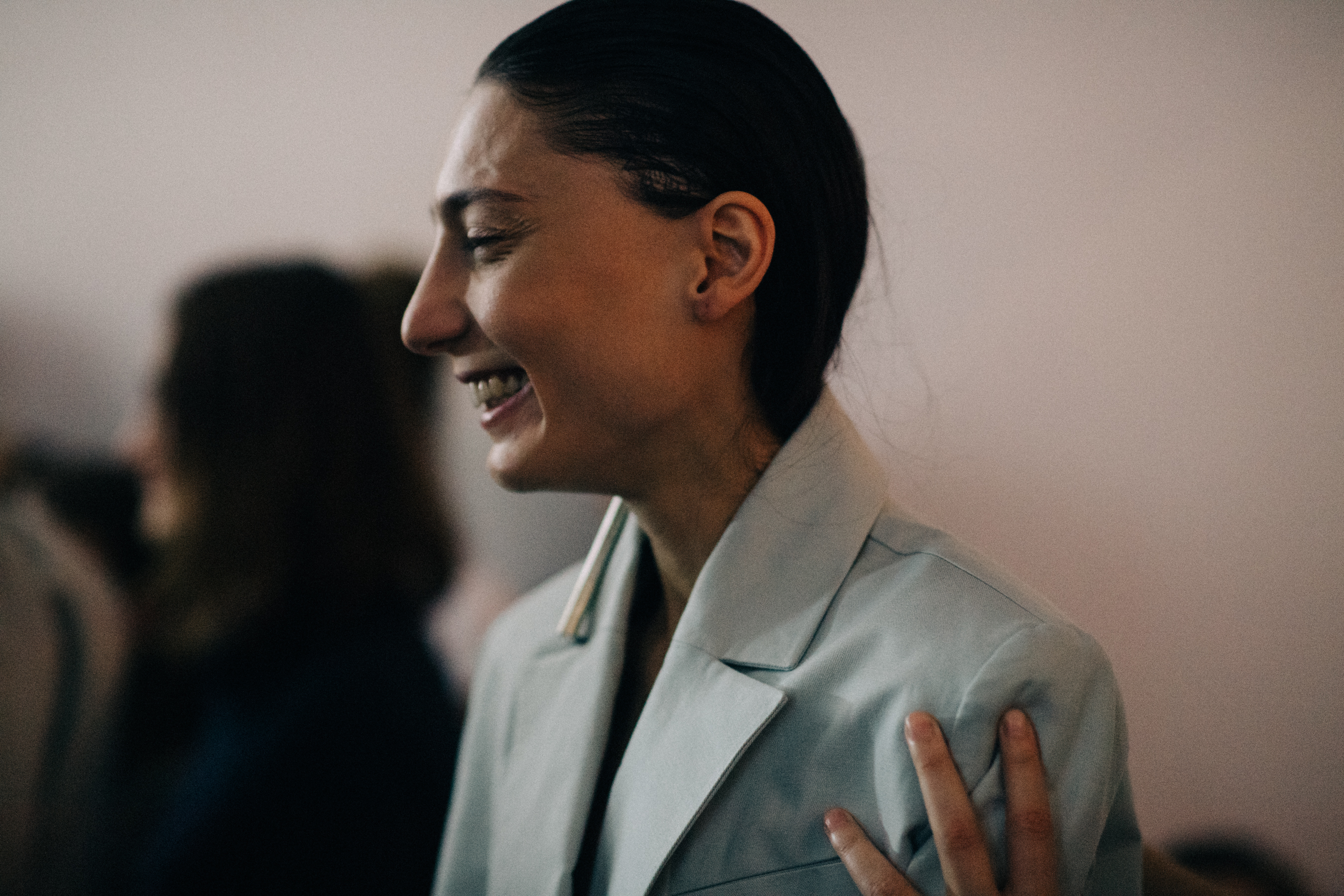 Model wearing blue jacket