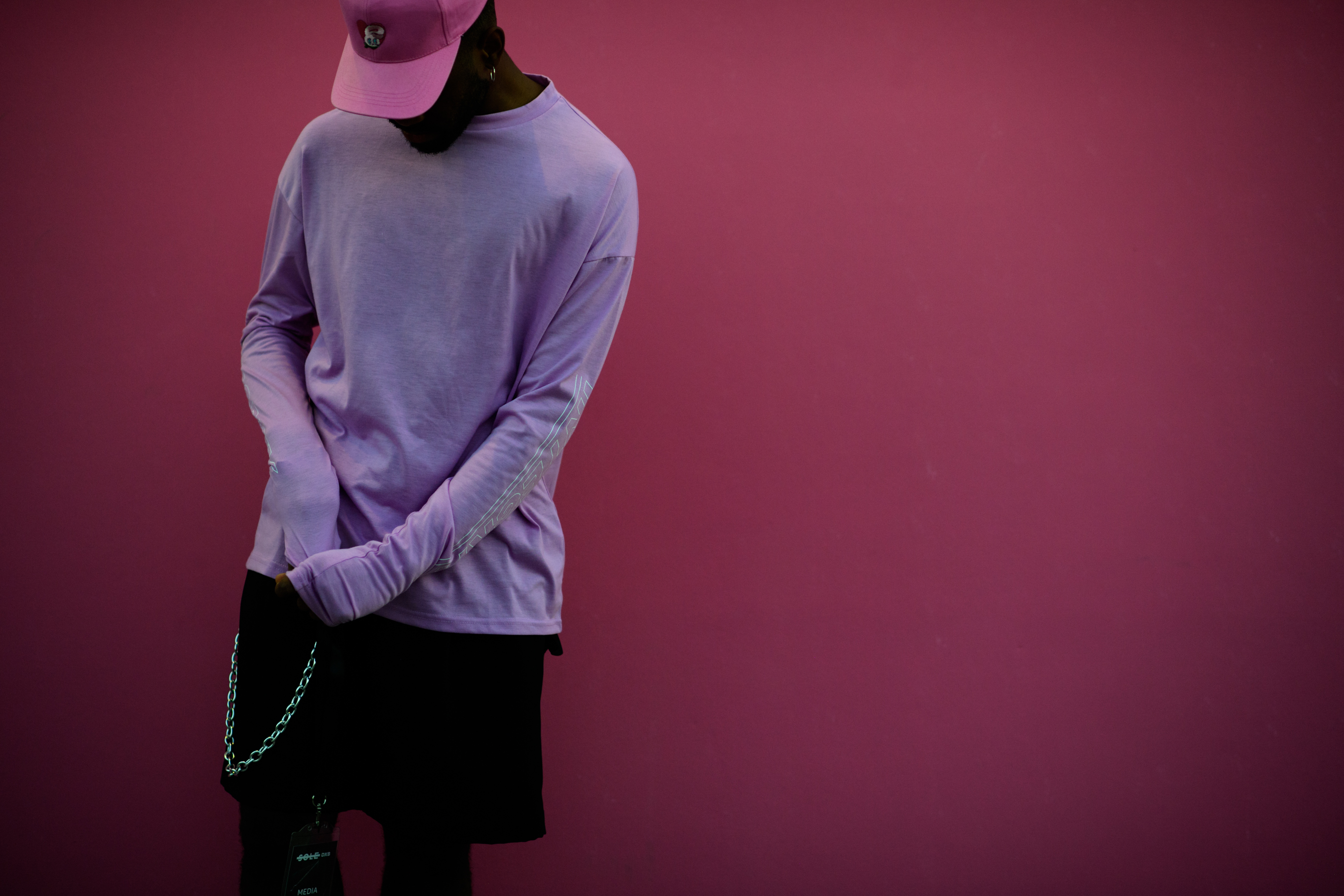 Man wearing purple and pink