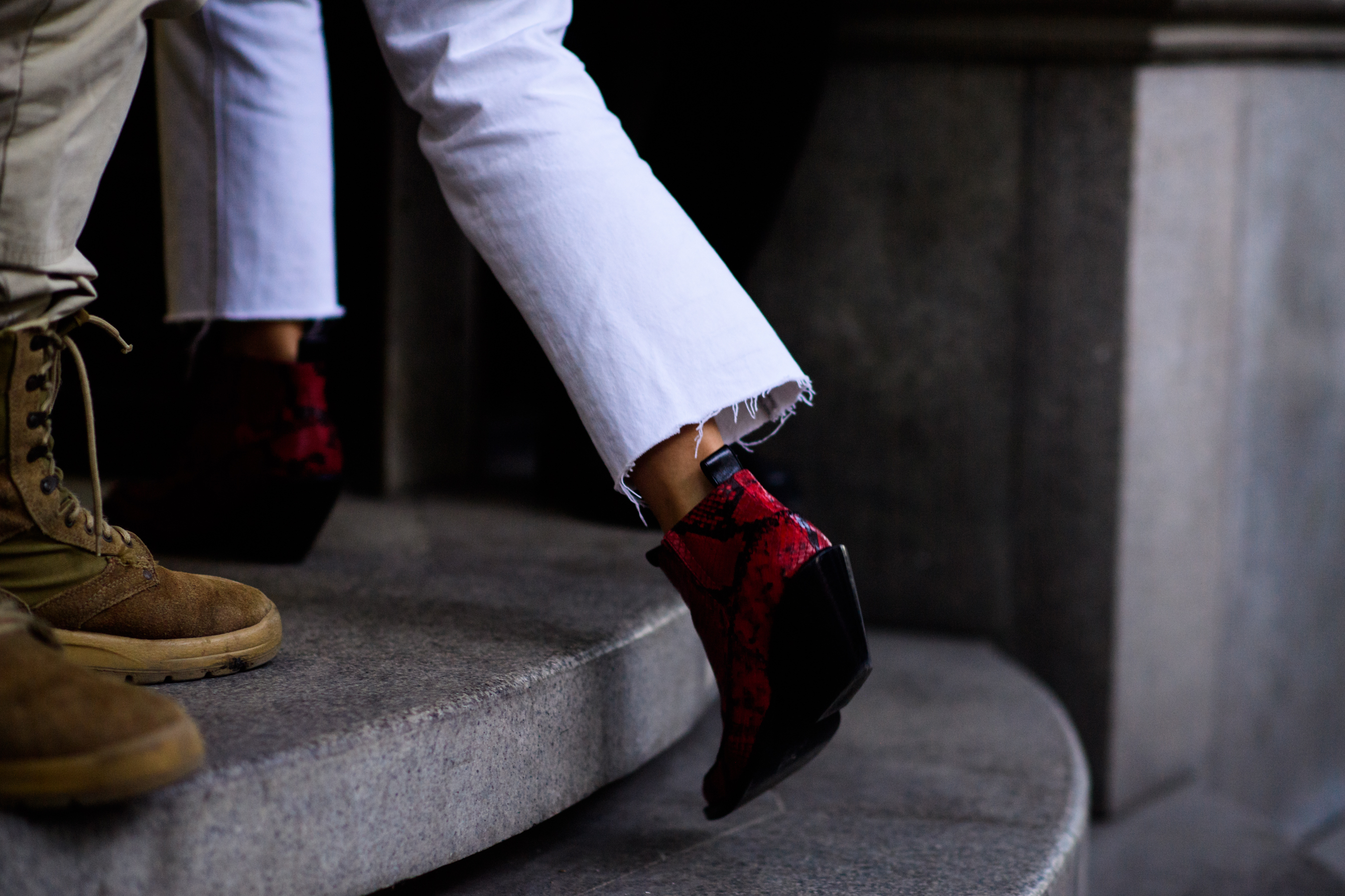 Girl wearing cowboy boots and cropped jeans