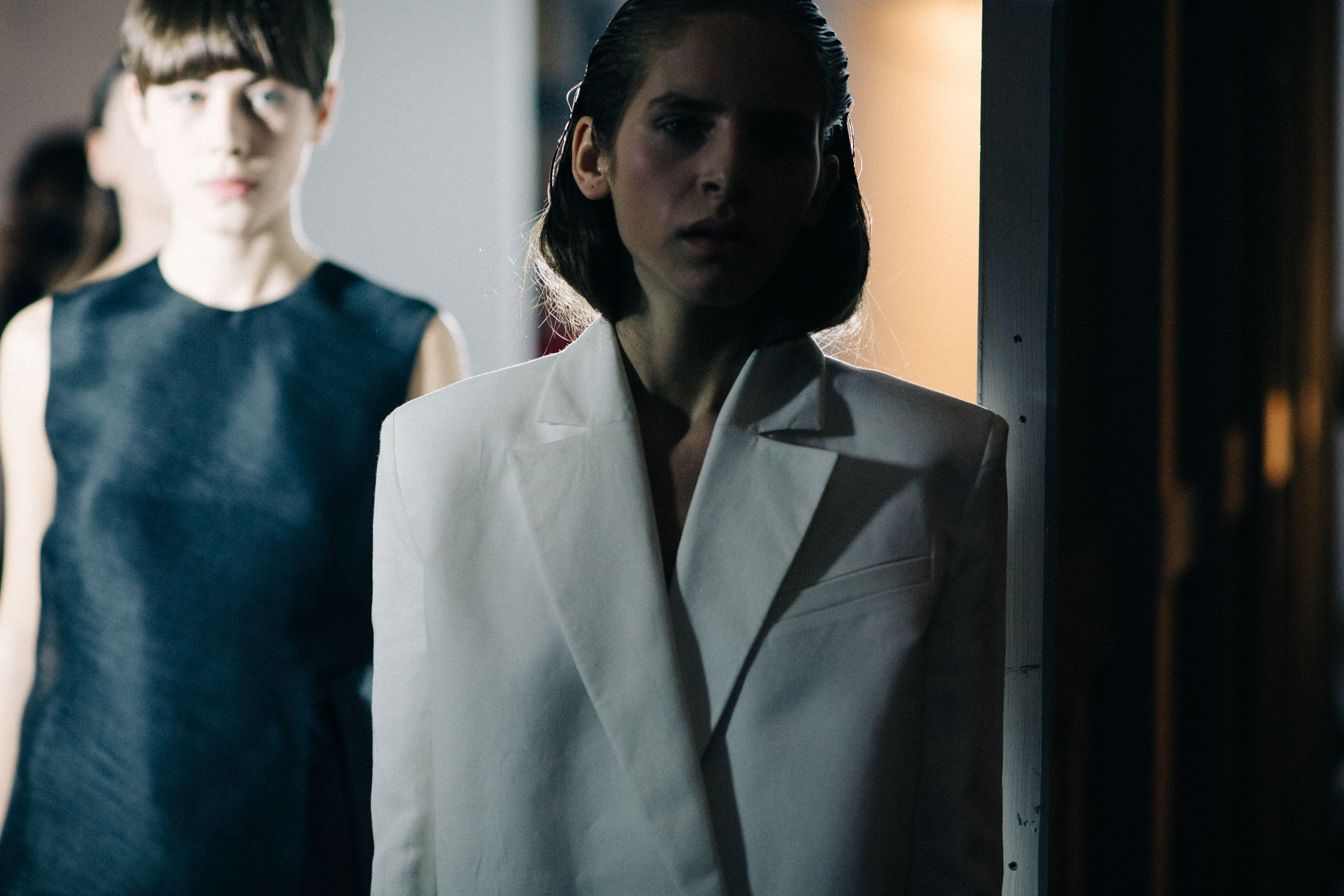 Model wearing white jacket