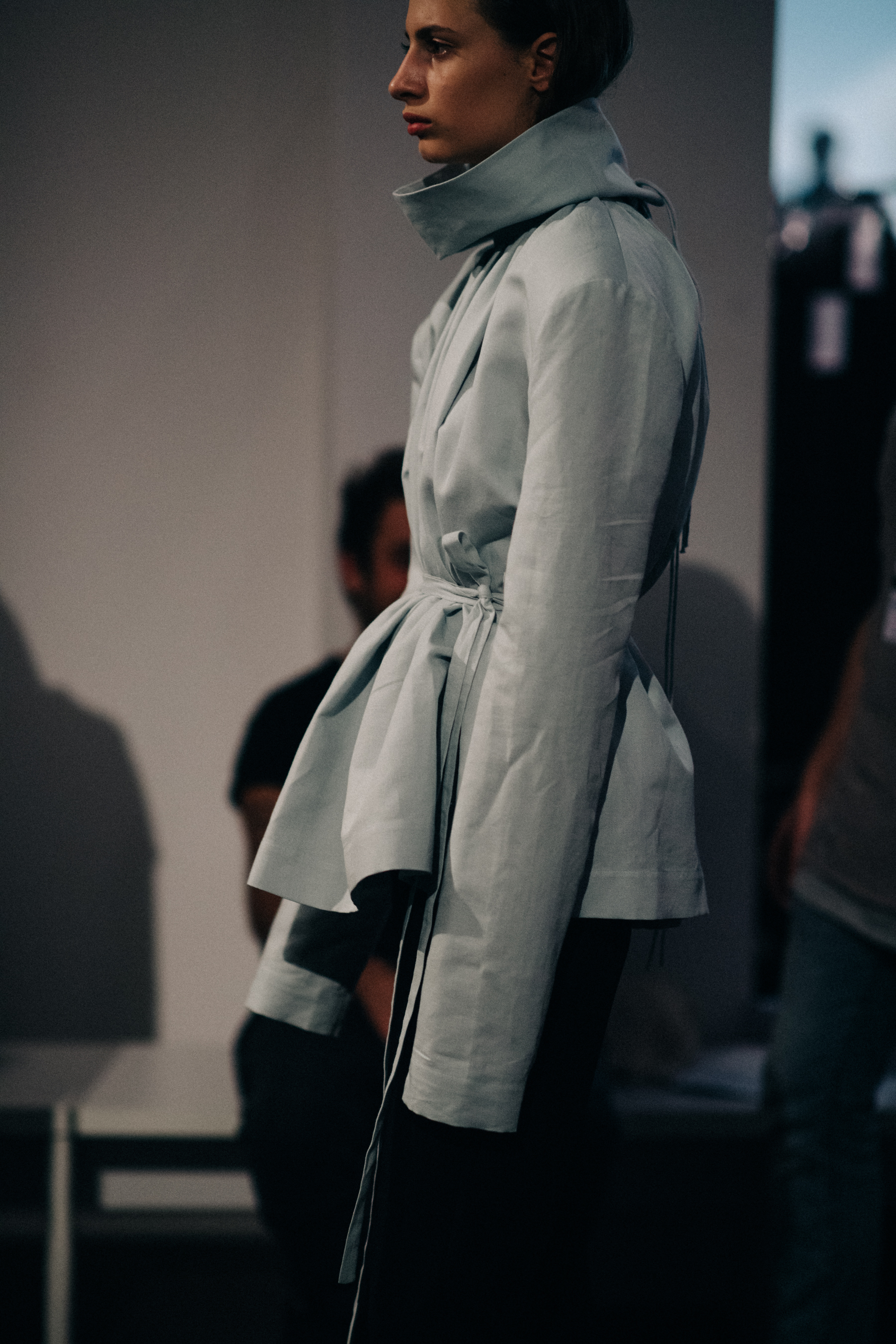 Model wearing grey jacket