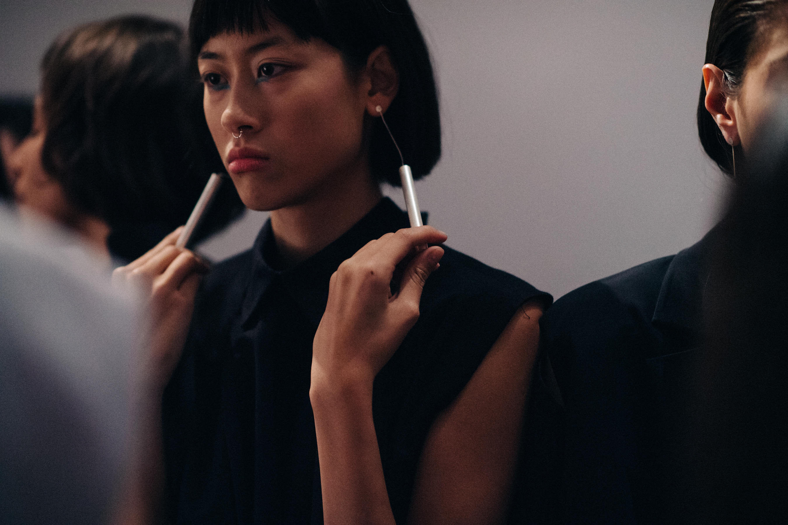 Model wearing tall earrings