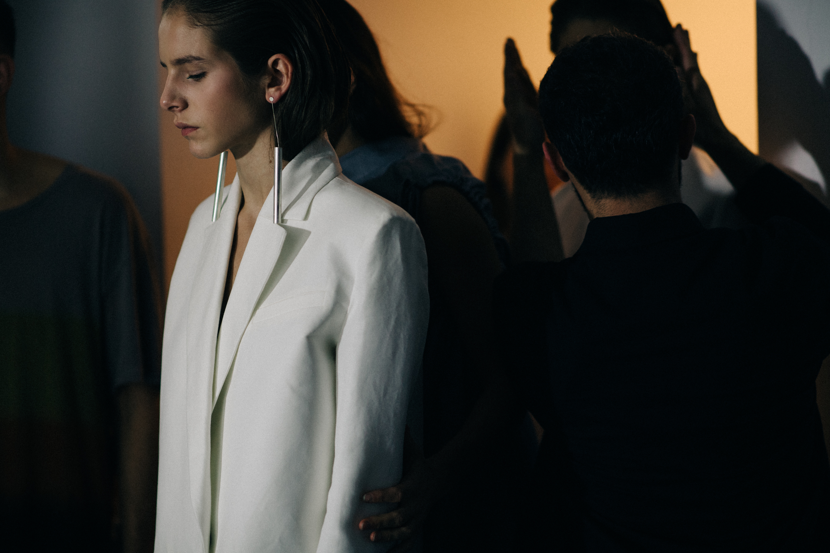 Model wearing white jacket