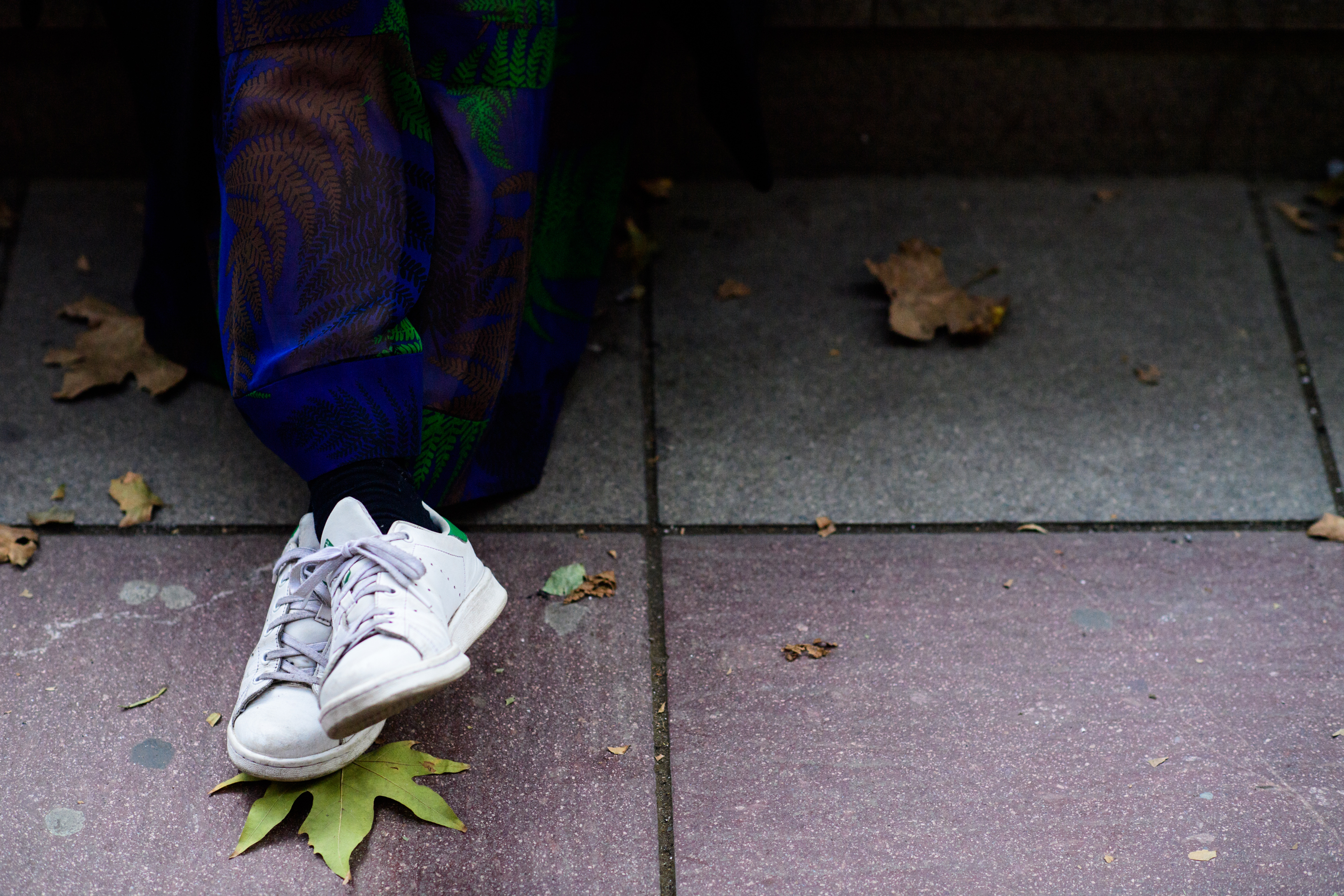 Woman wearing Adidas Stan Smith sneakers