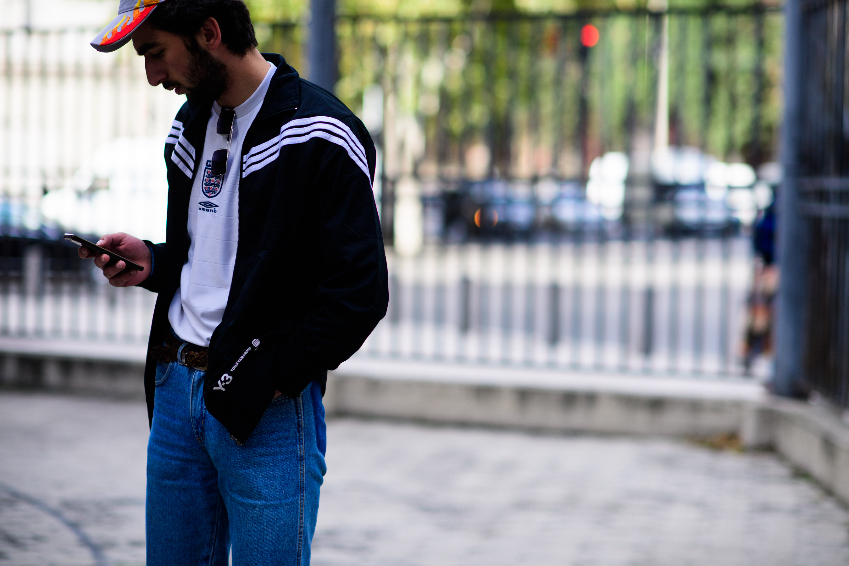 Man wearing Y-3 jacket and hat