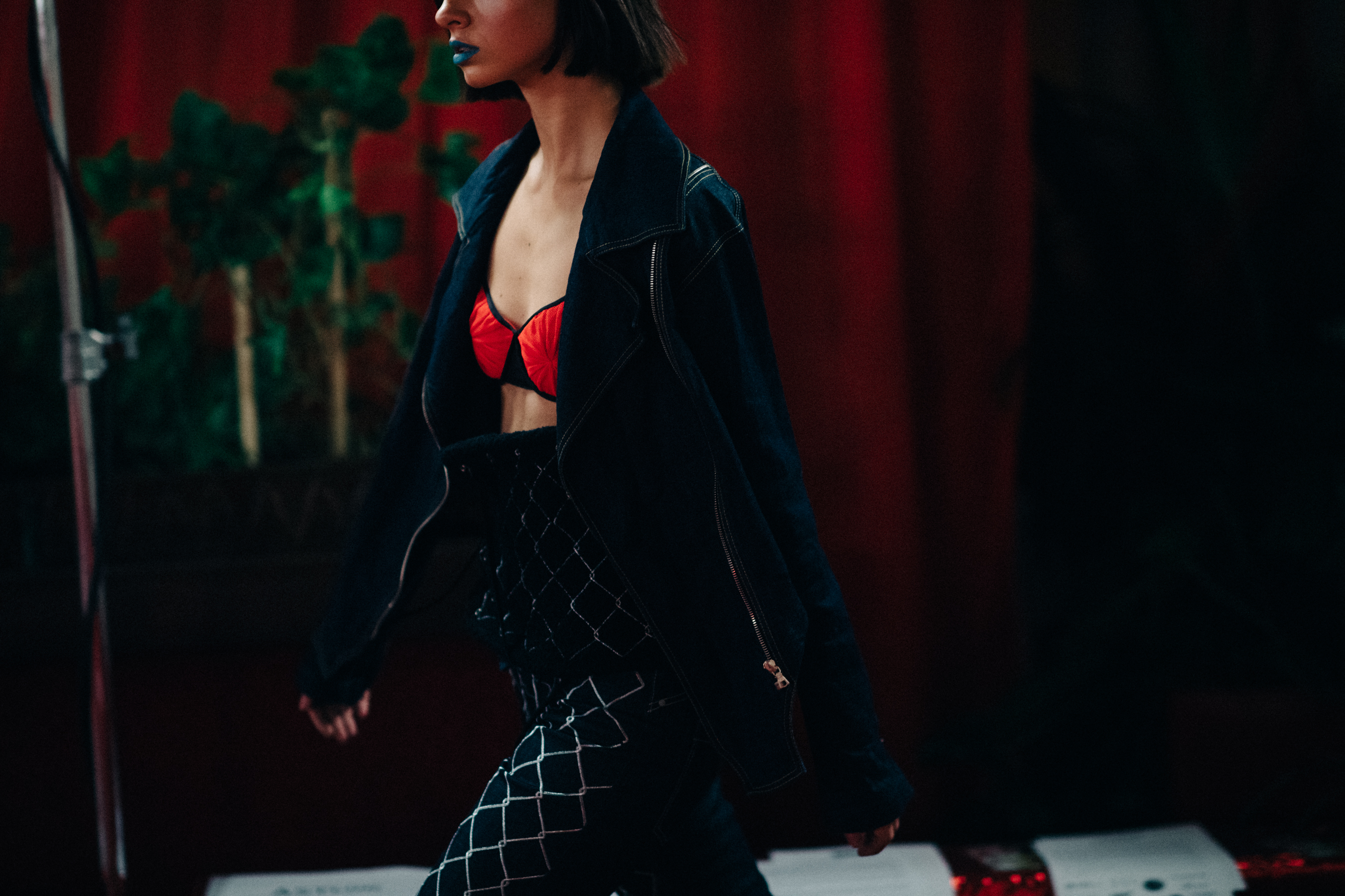 Woman wearing brassiere under jacket