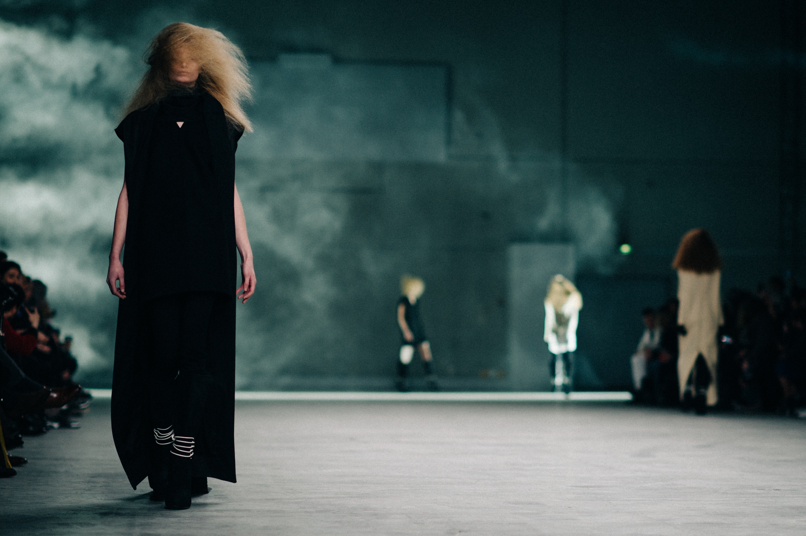 Model wearing long black coat