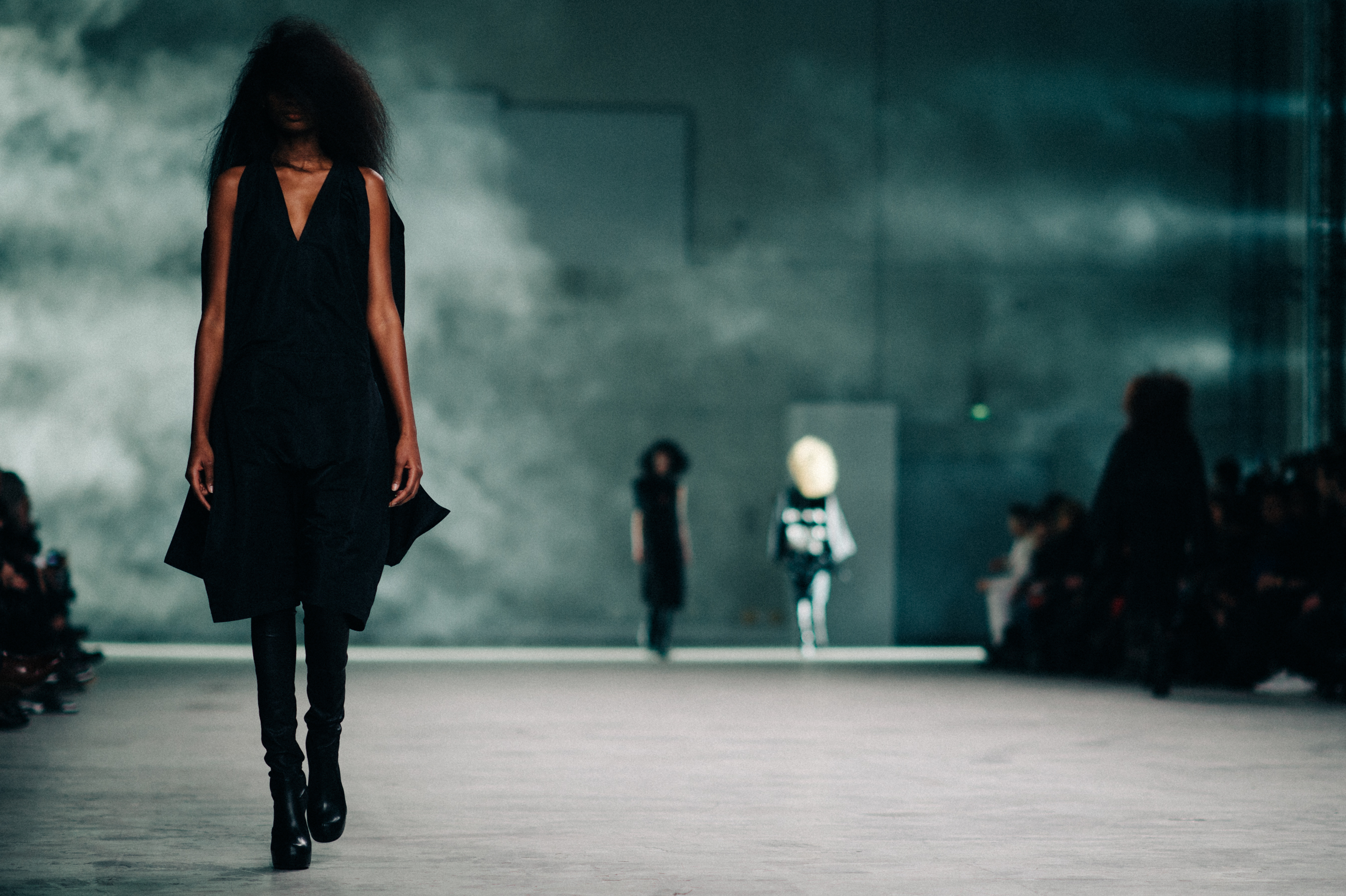 Model wearing black on the runway