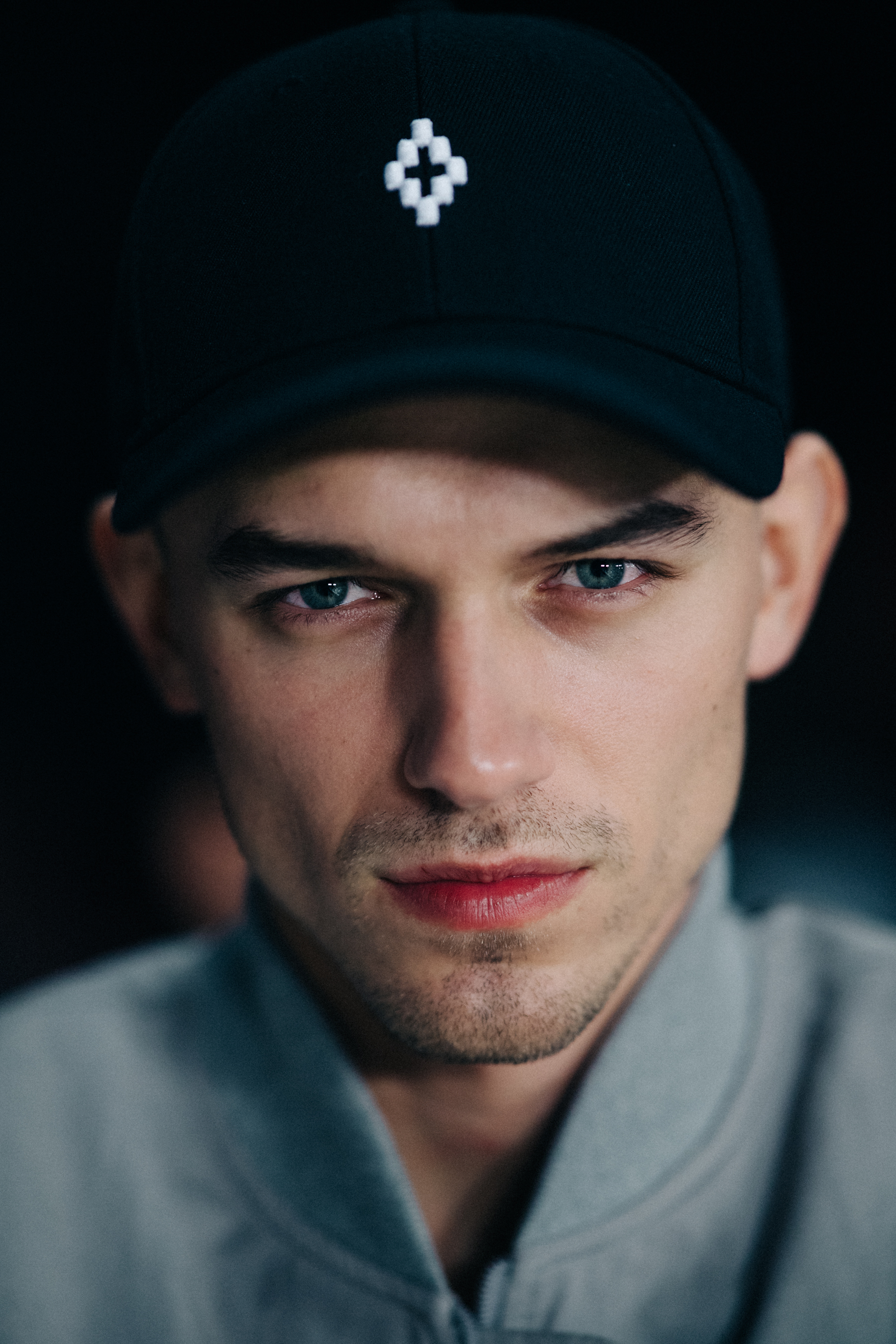 Portrait of model wearing black cap