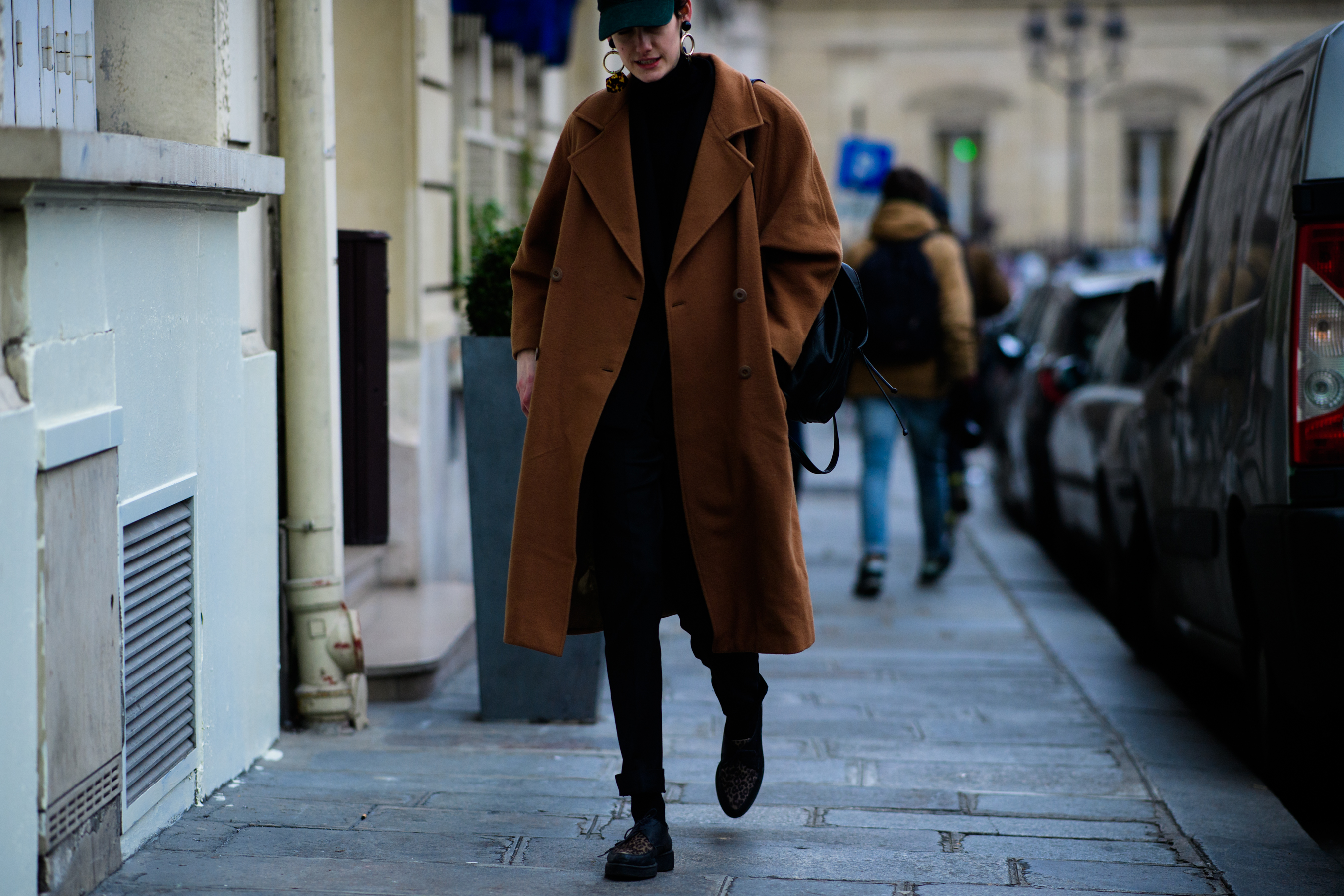Woman wearing brown coat