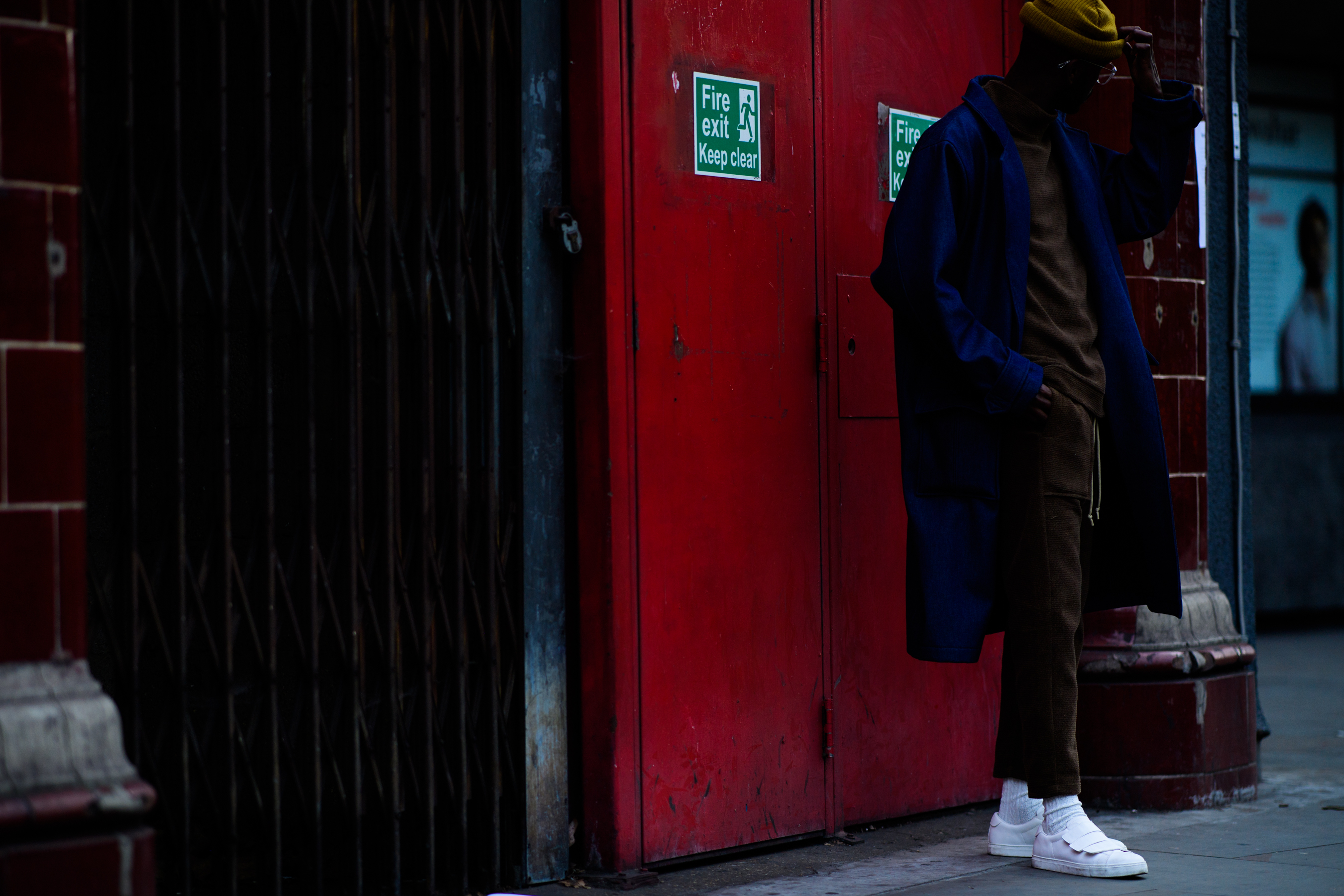 African man wearing blue coat