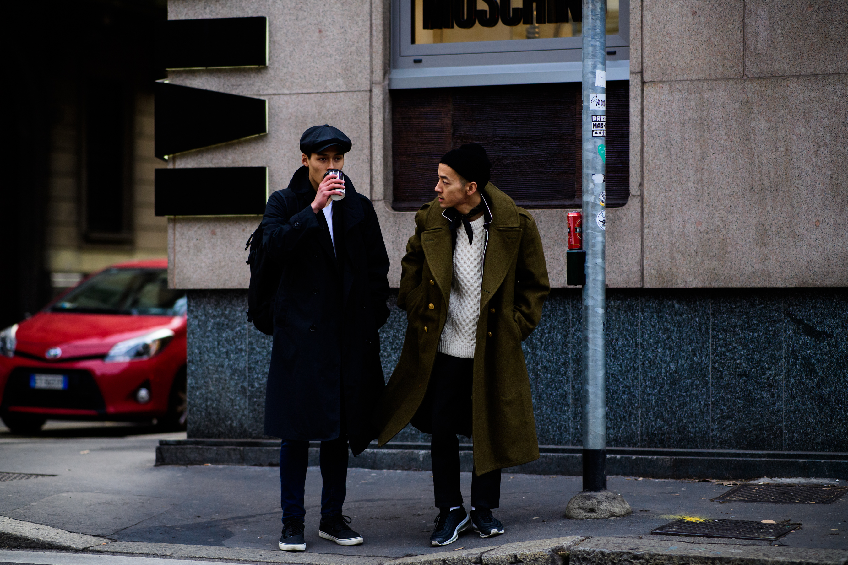 Asian men wearing coats