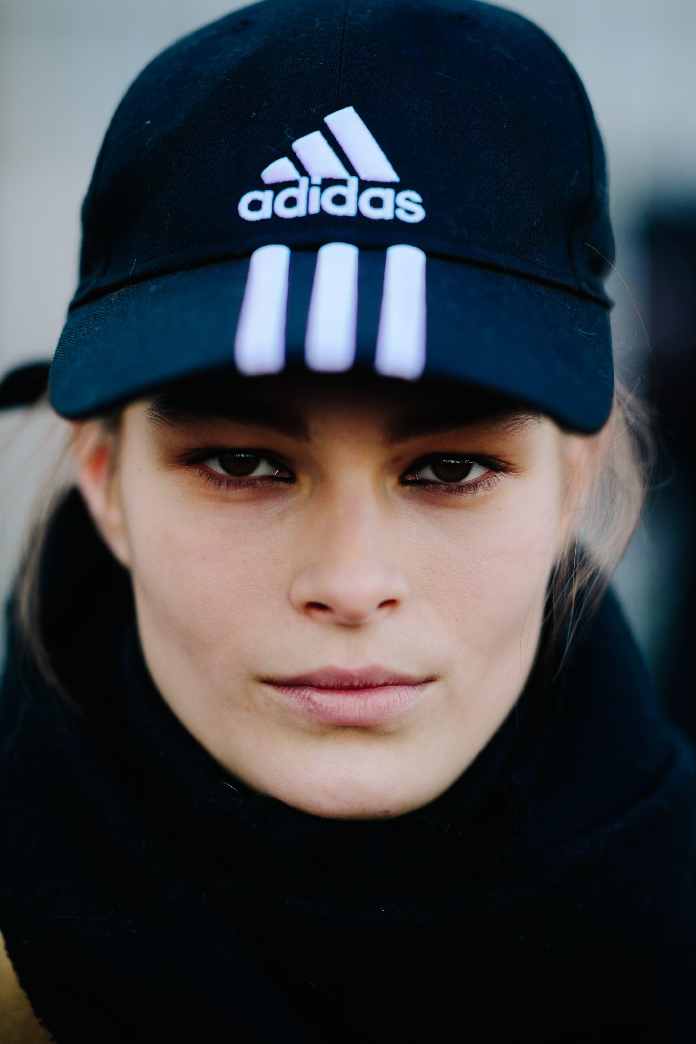 Portrait of woman with Adidas cap