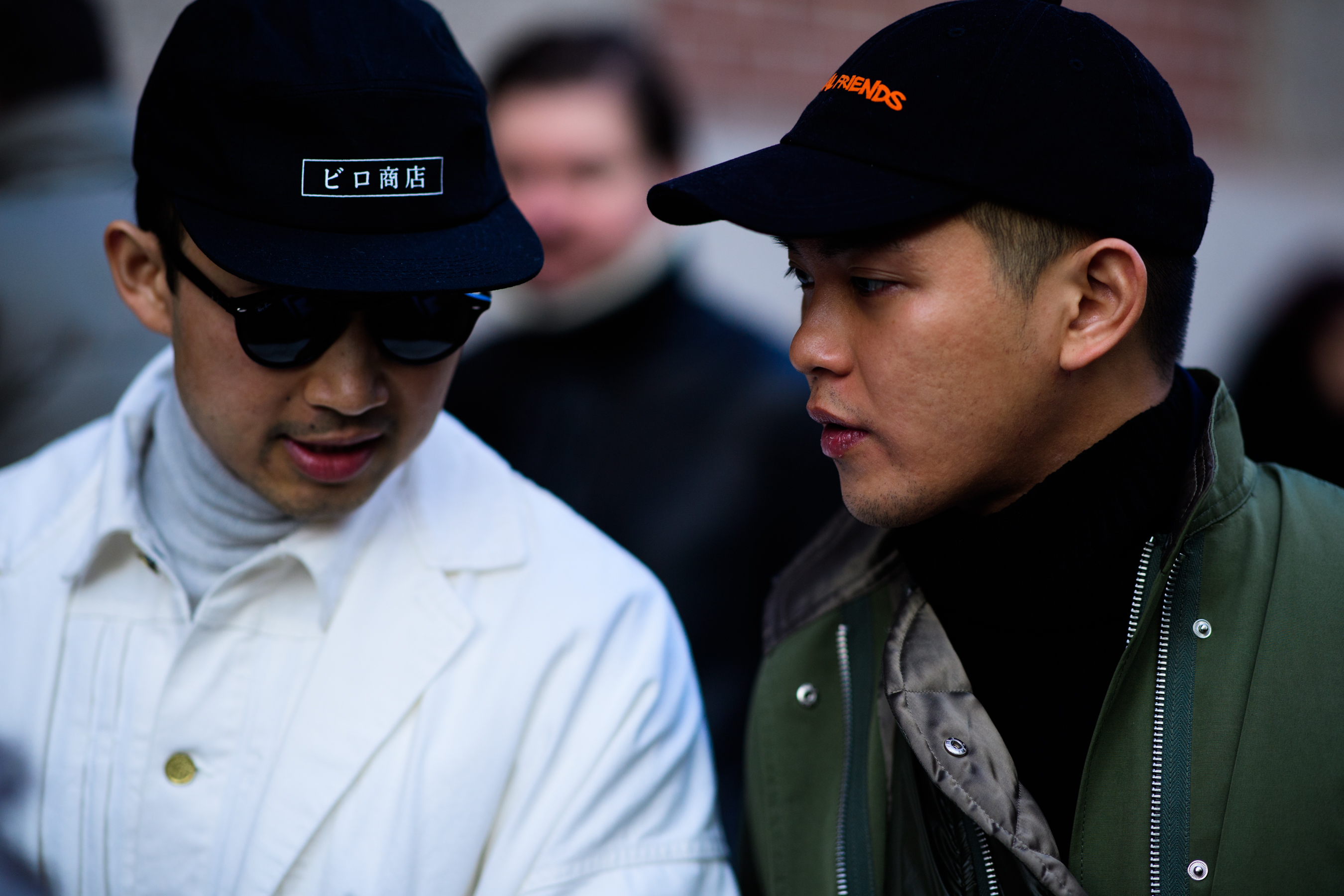 Asian people wearing caps