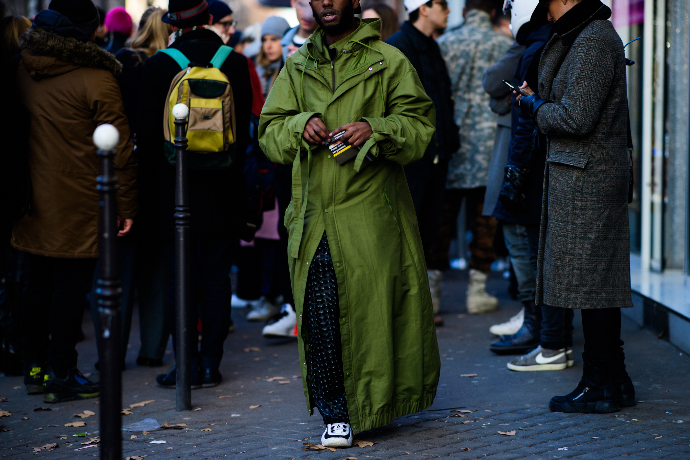 Man wearing green cloak