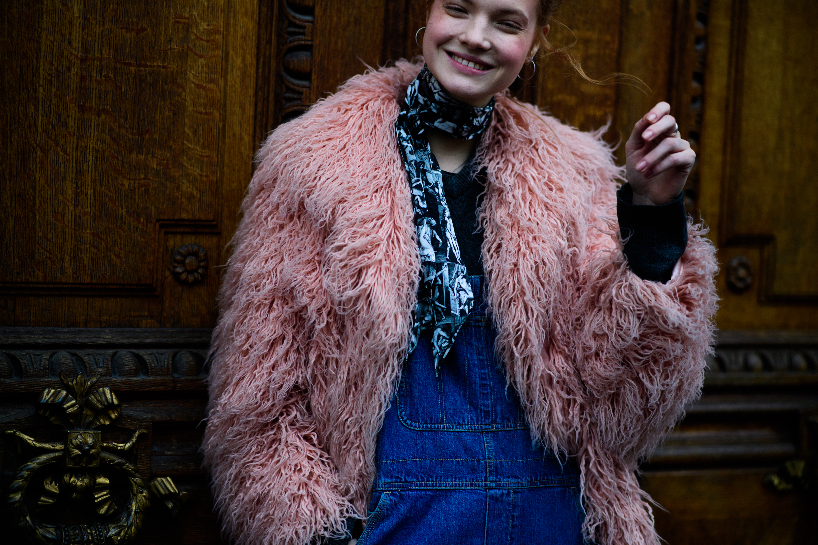 Woman wearing pink fur coat