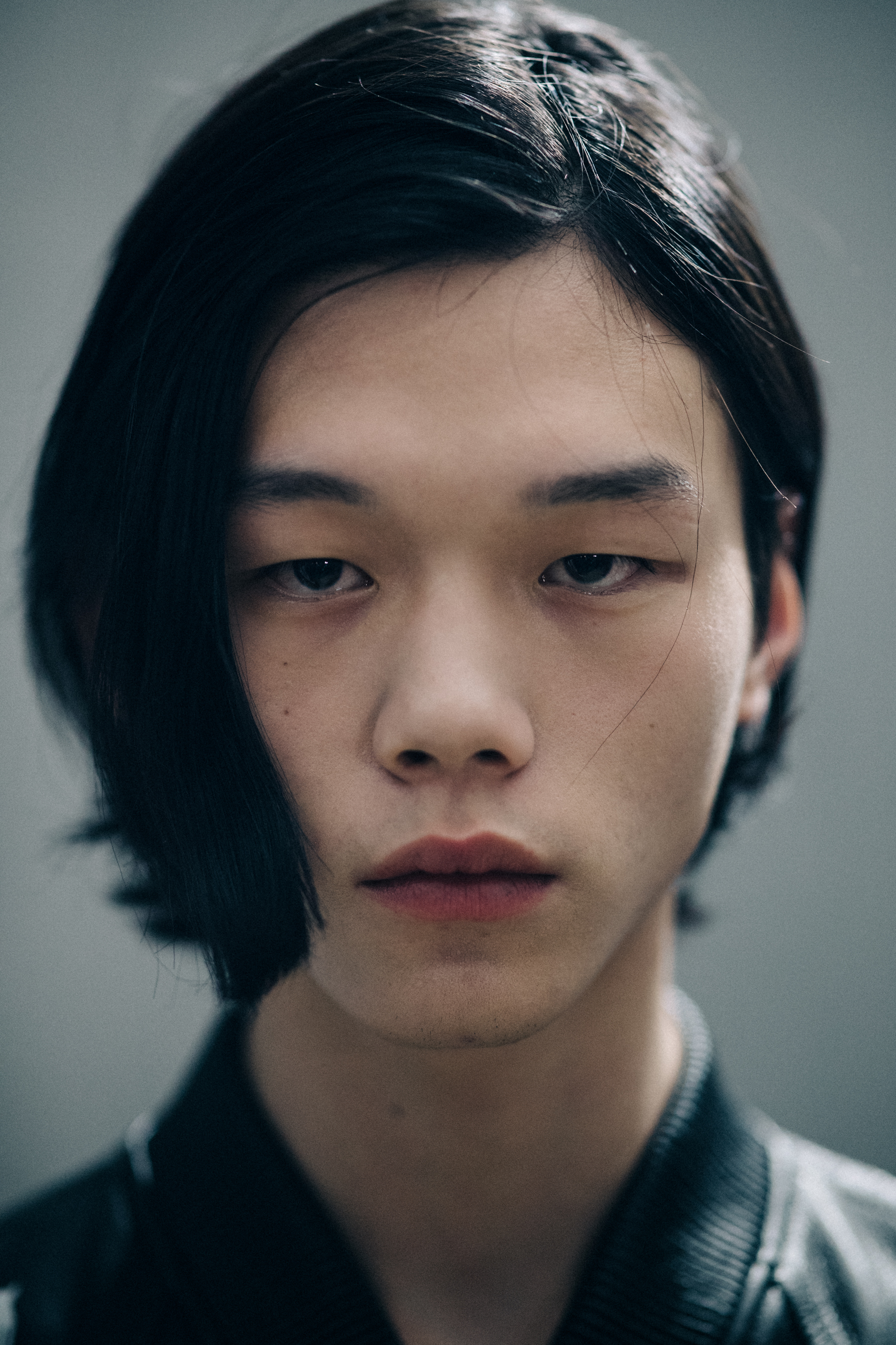 Portrait of asian male model with long hair