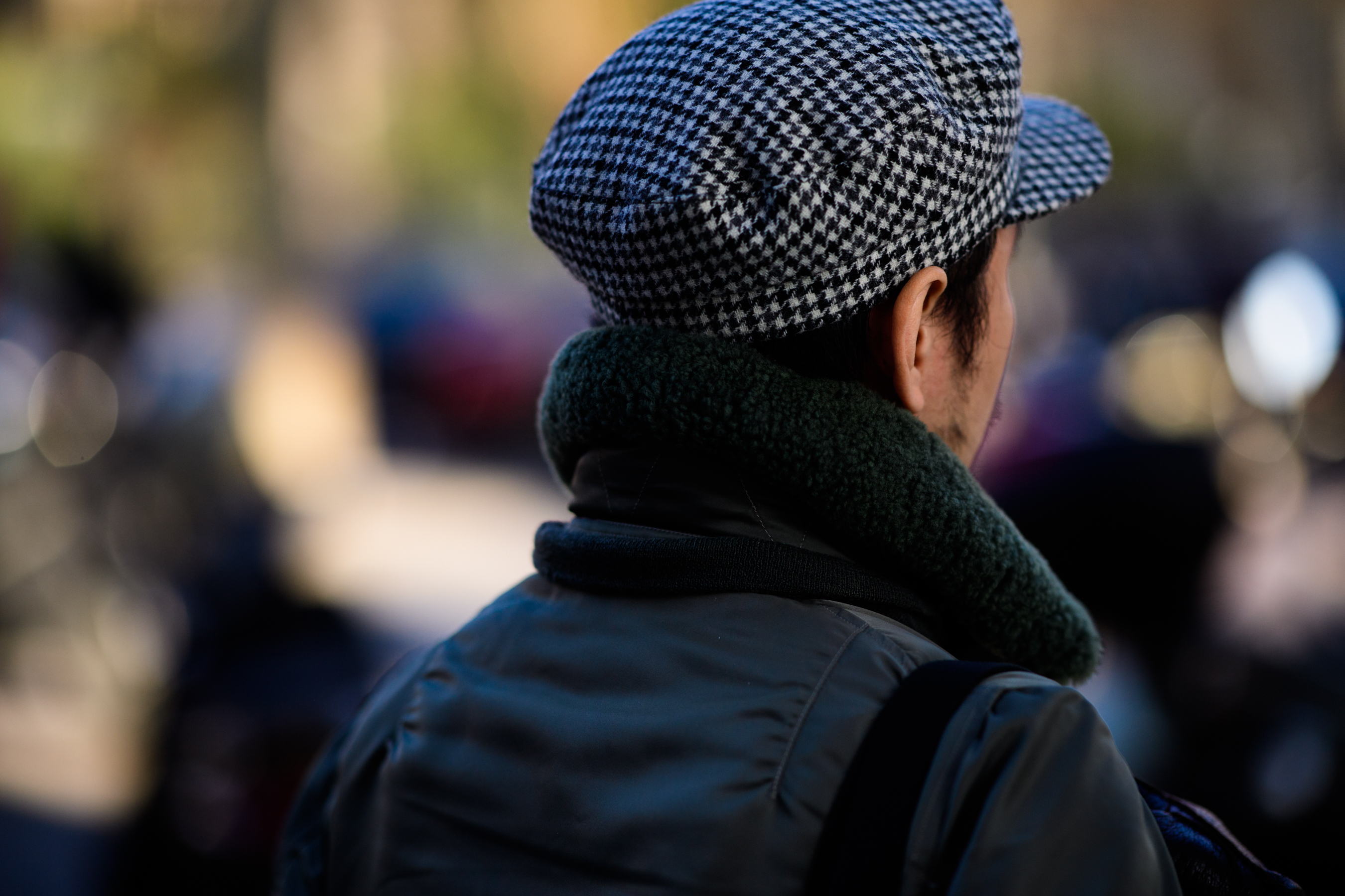 Asian man wearing cap