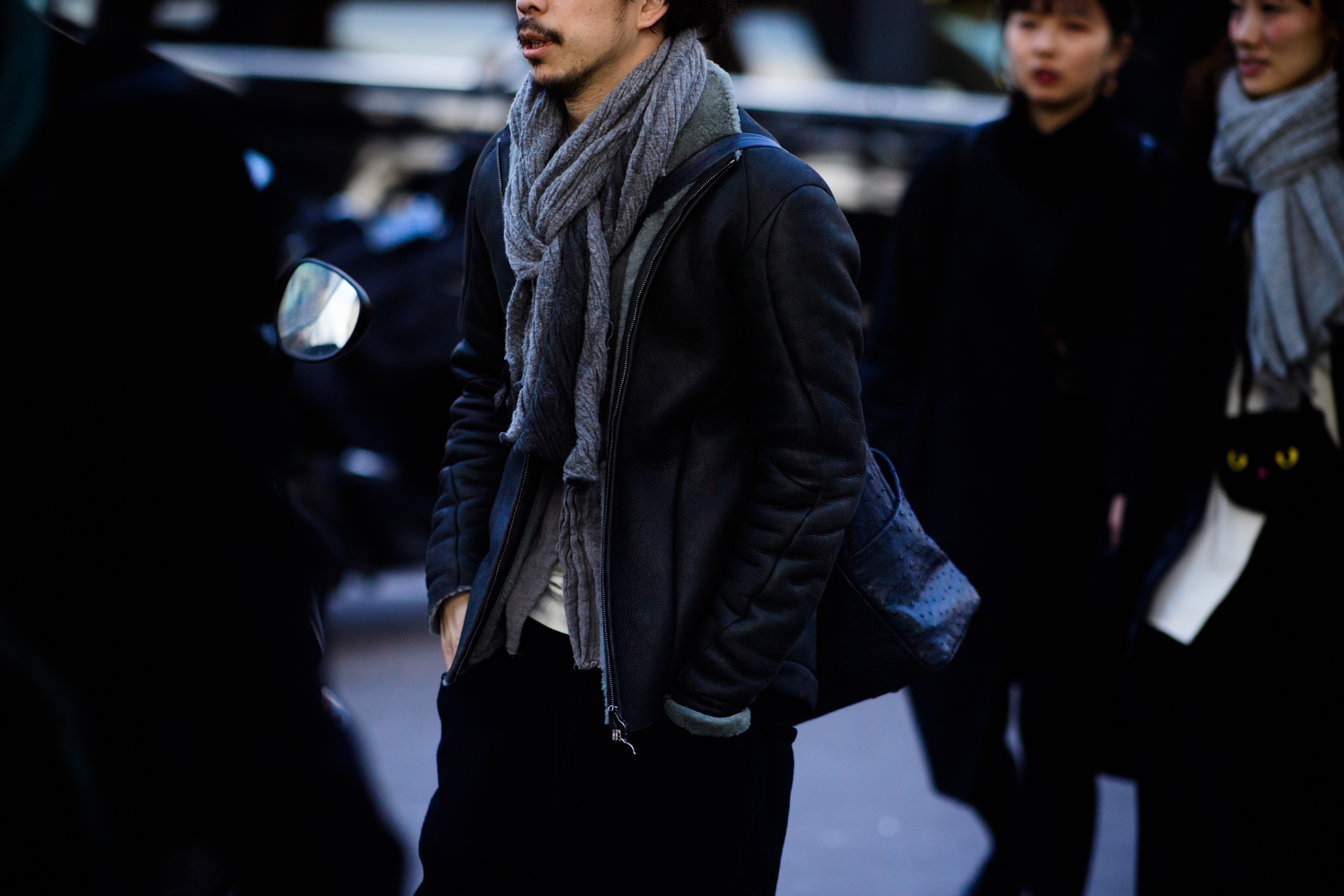 Man wearing grey scarf