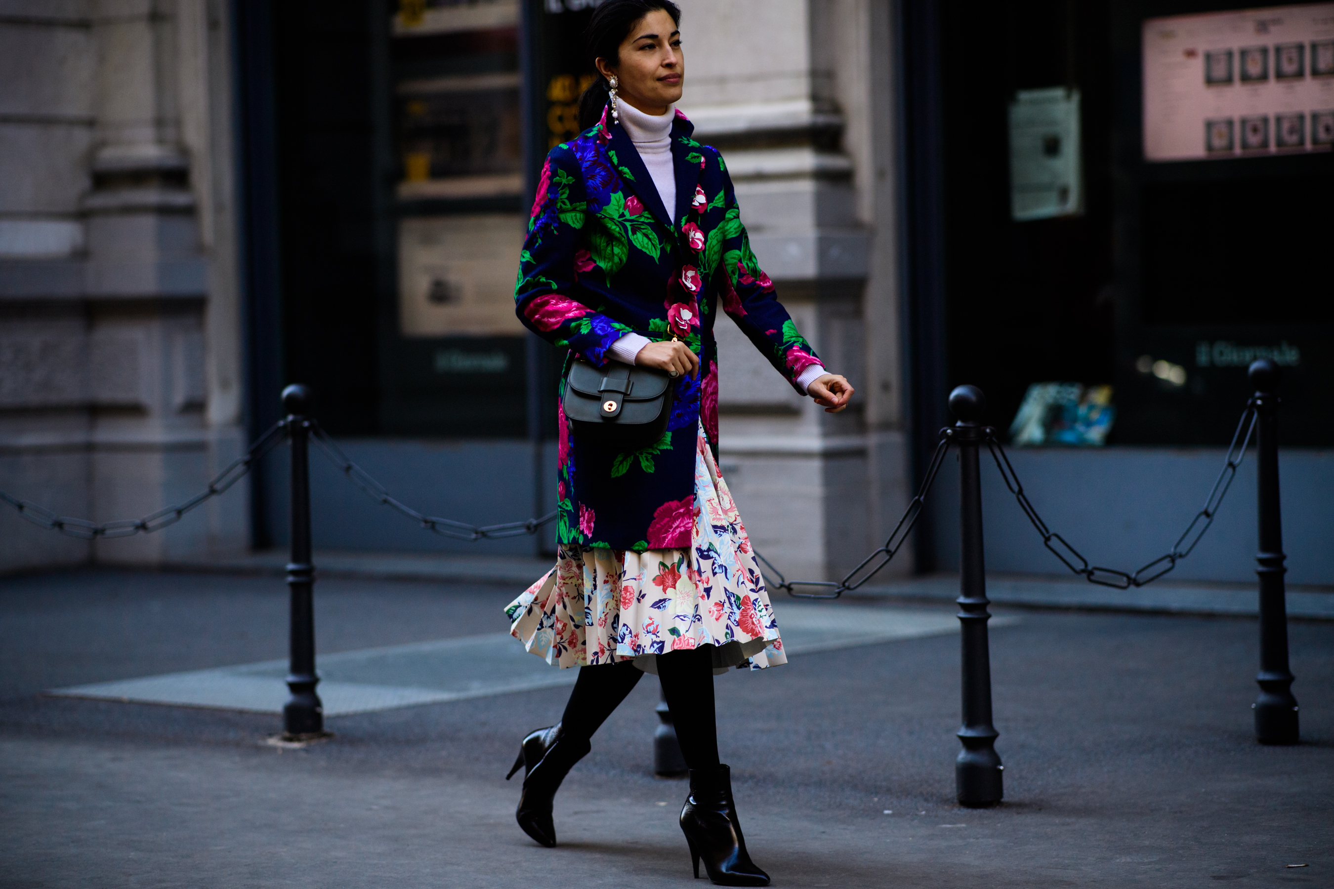Woman wearing green and blue jacket