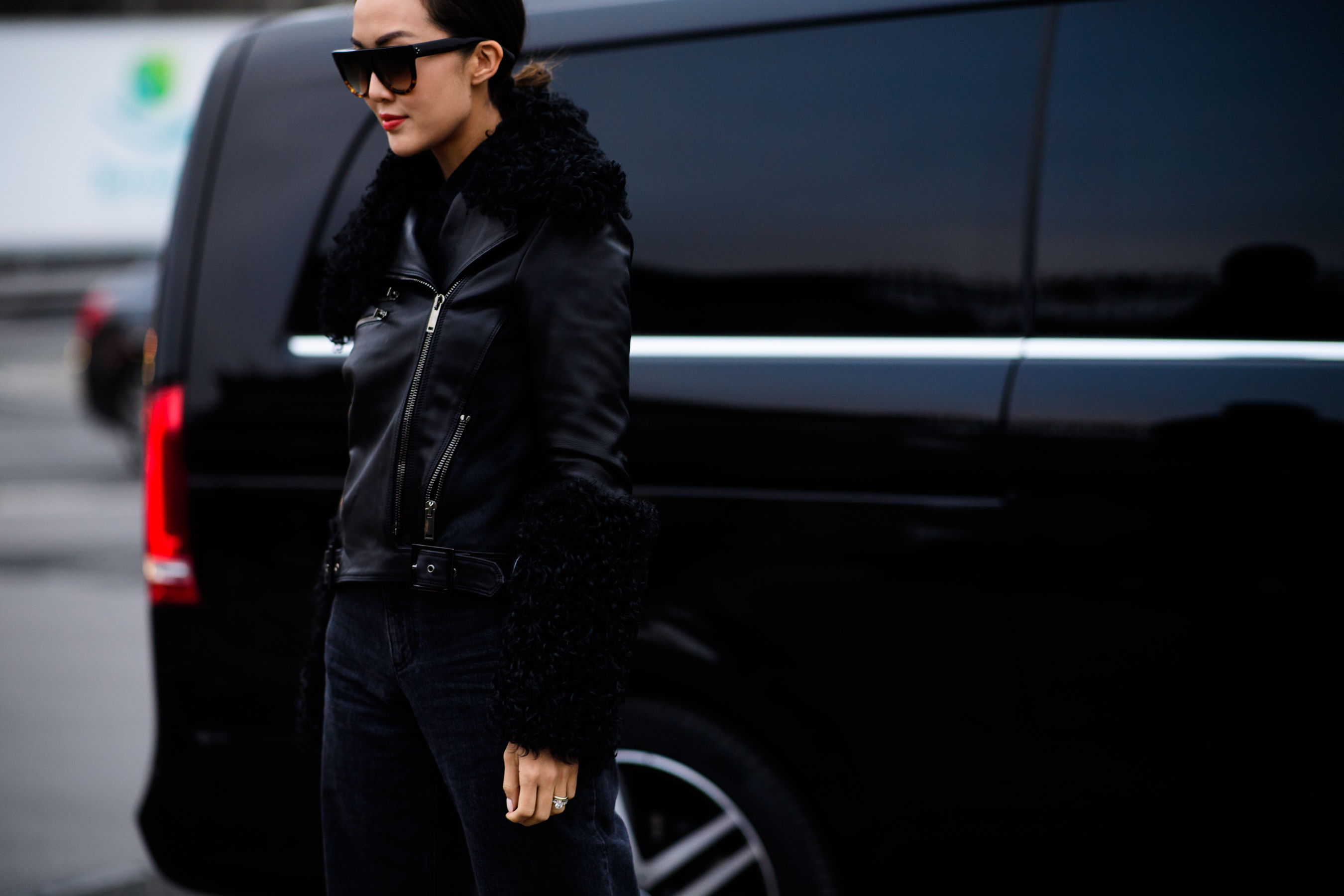 Woman wearing black clothes and sunglasses