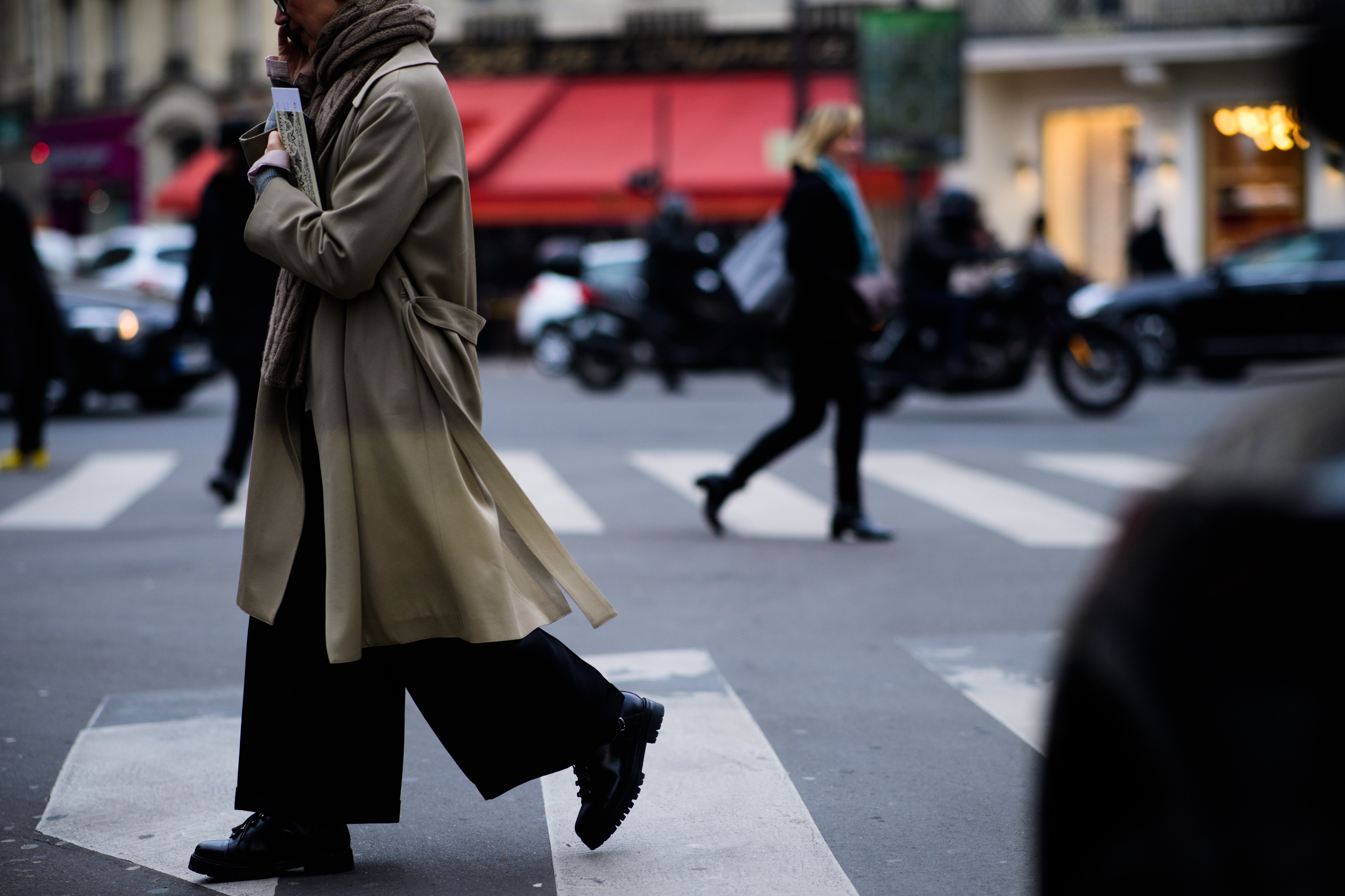 Woman wearing coat and big pants