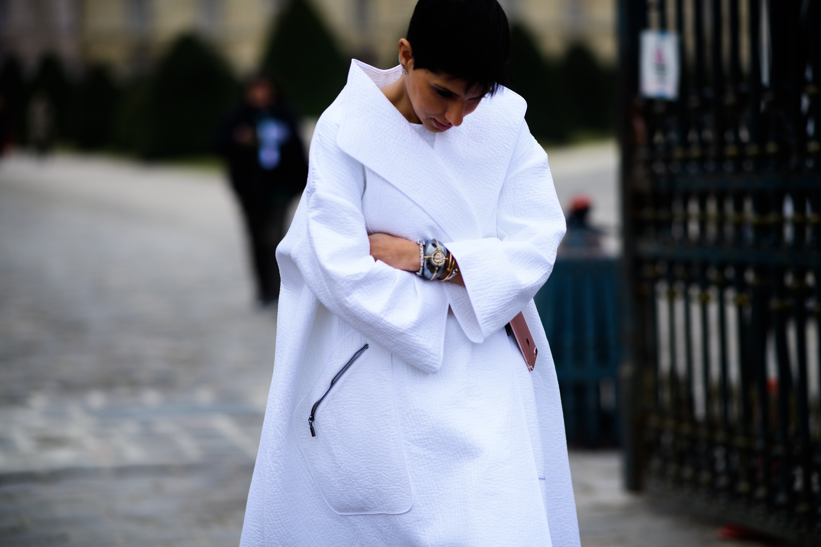 Woman wearing big white coat