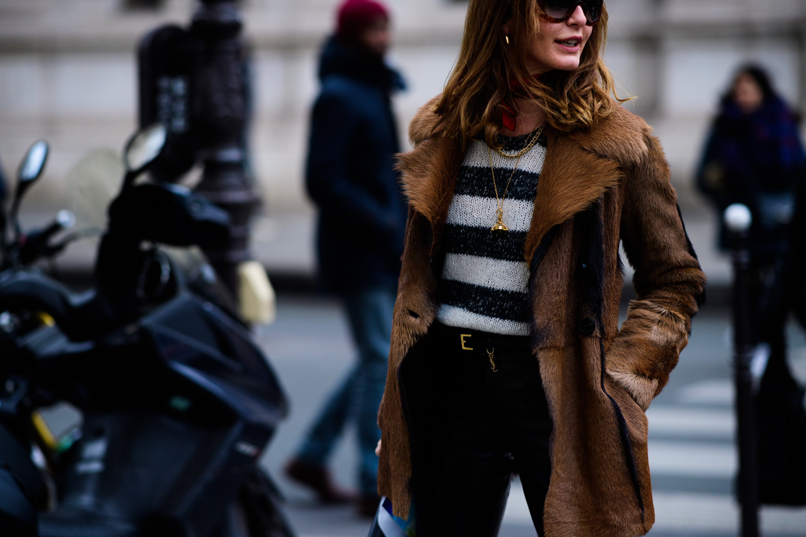Woman wearing brown fu coat