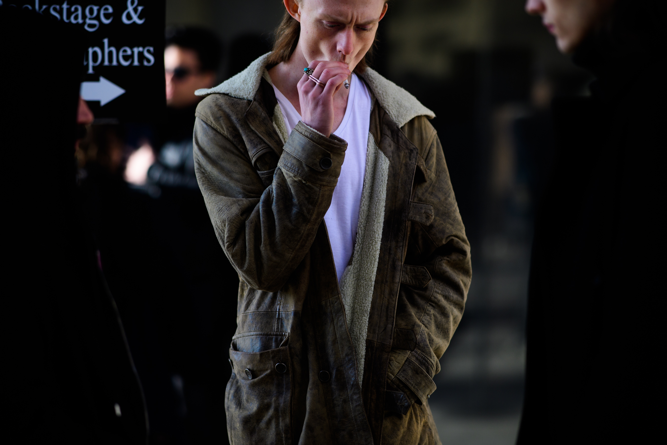 Man wearing brown coat