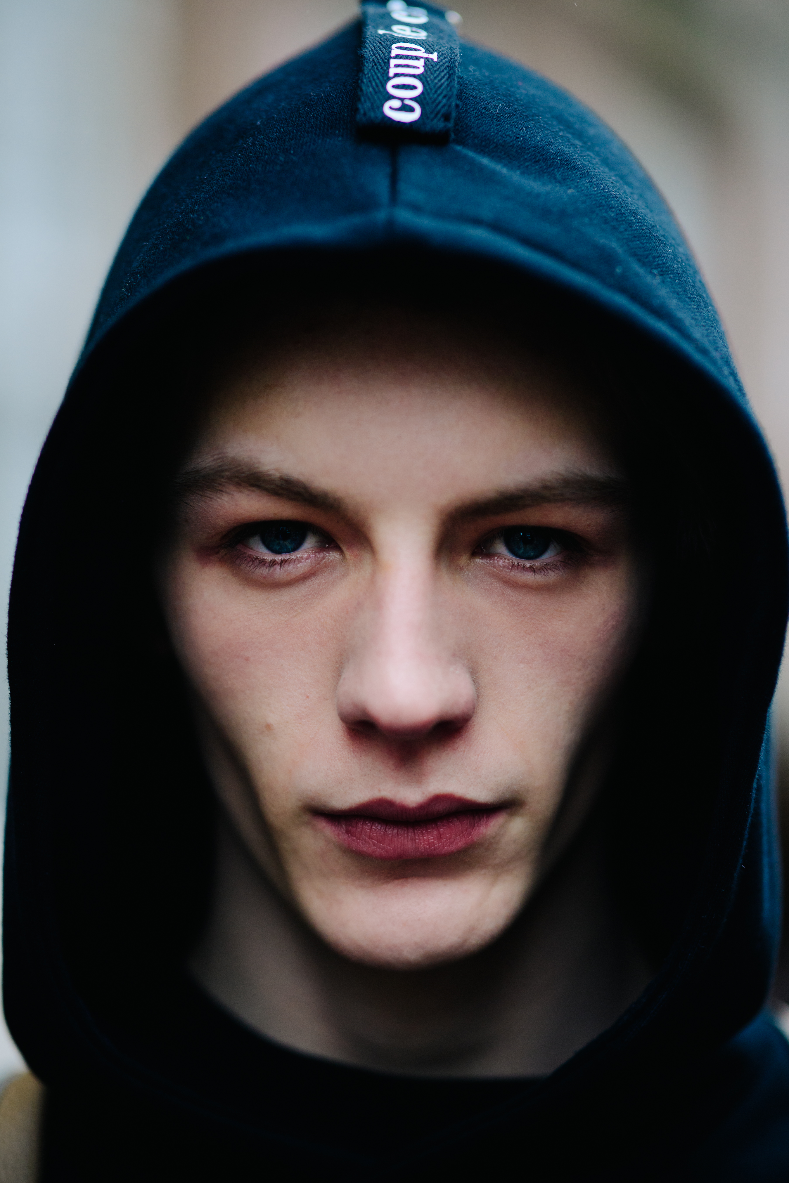 Portrait of male model wearing hood
