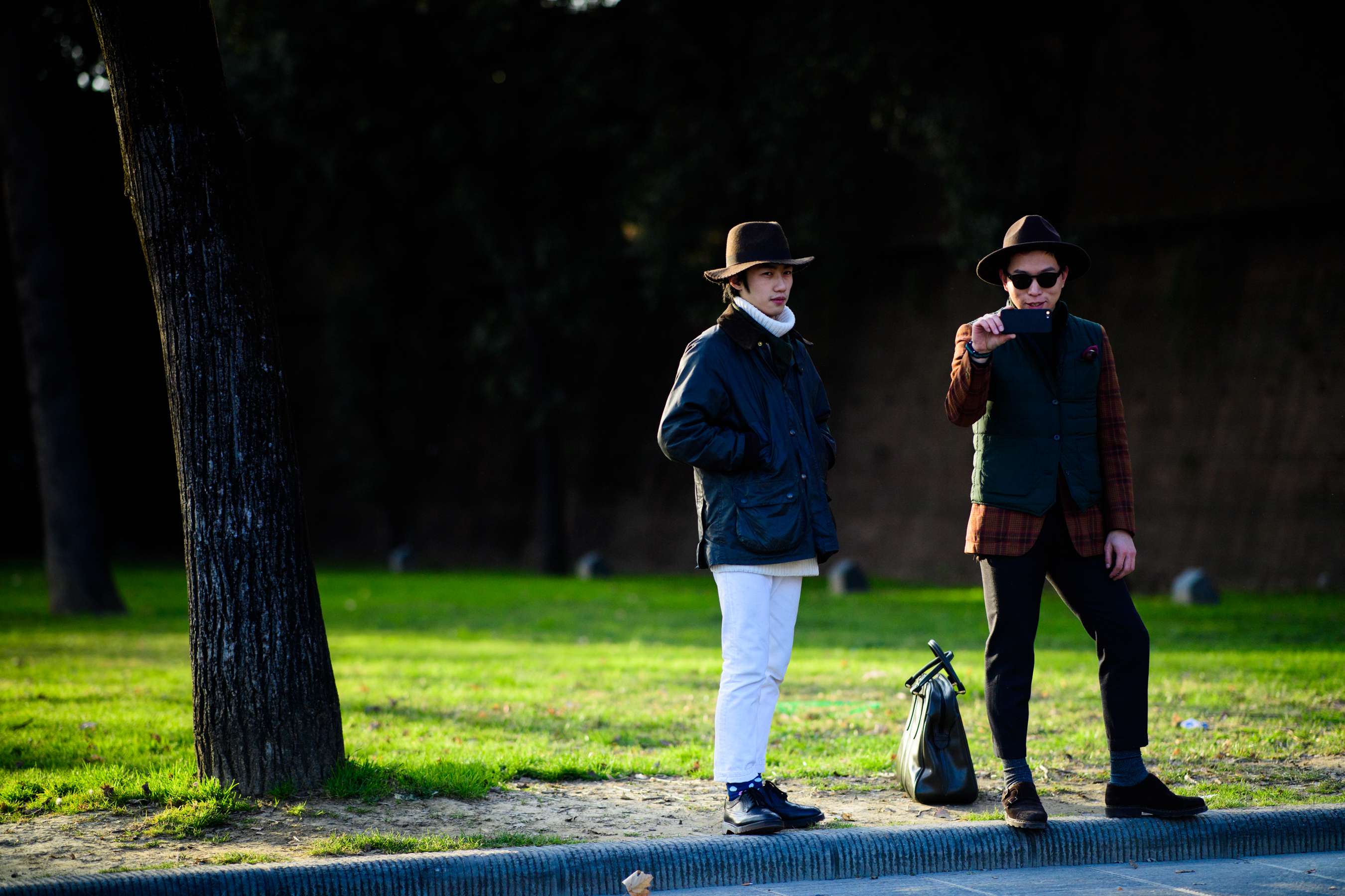 Asian people wearing big hats