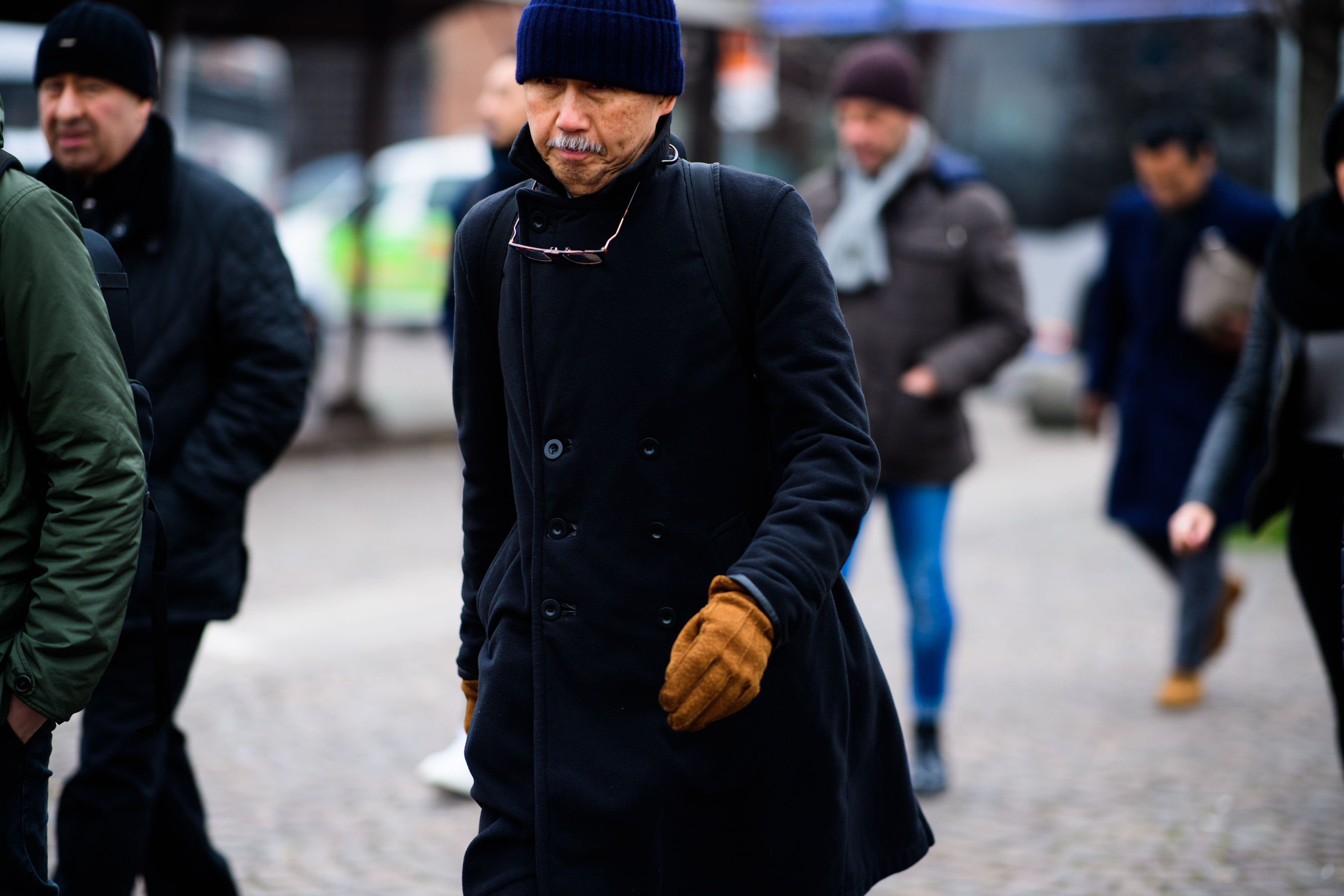 Old man wearing black coat and hat