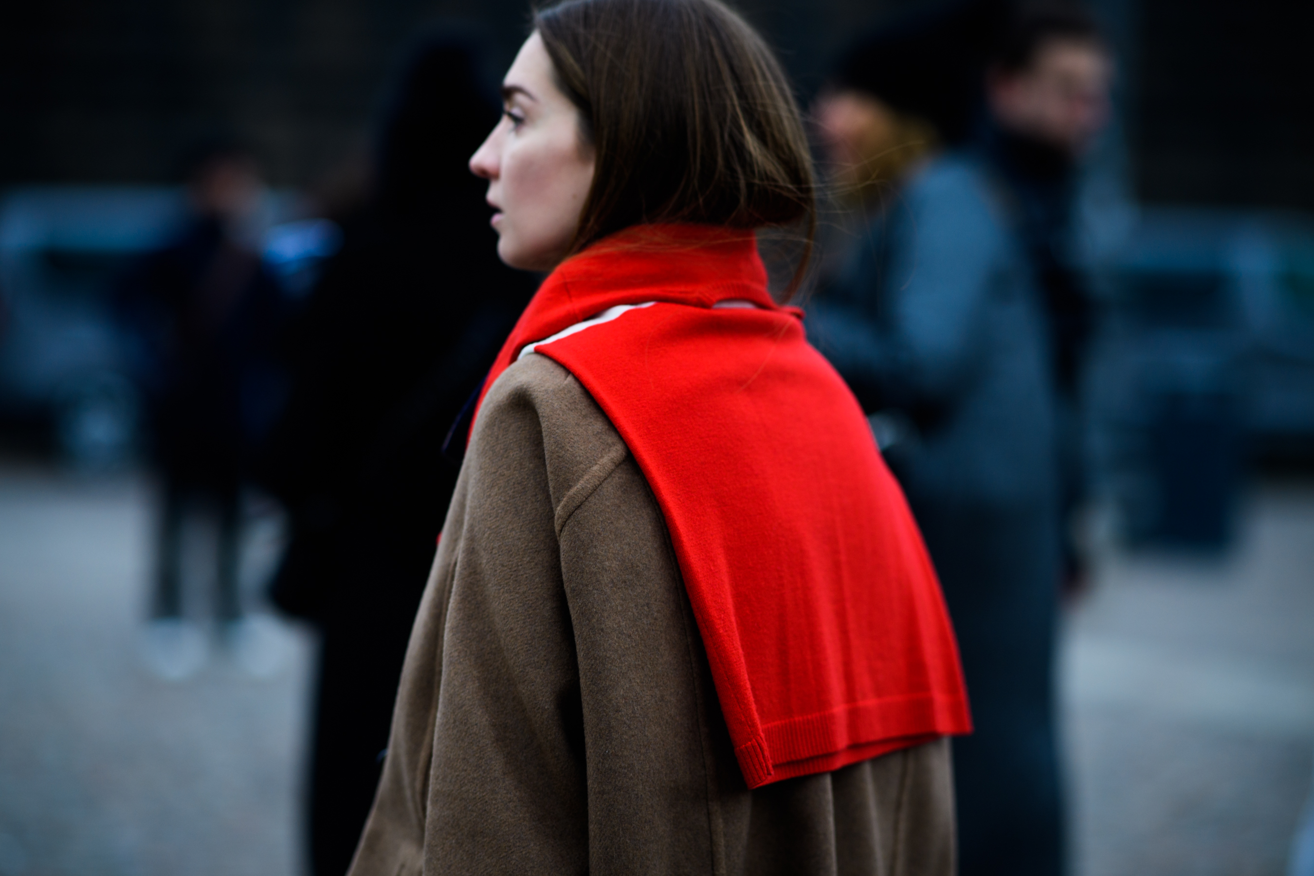 Woman with red sweater on shoulders