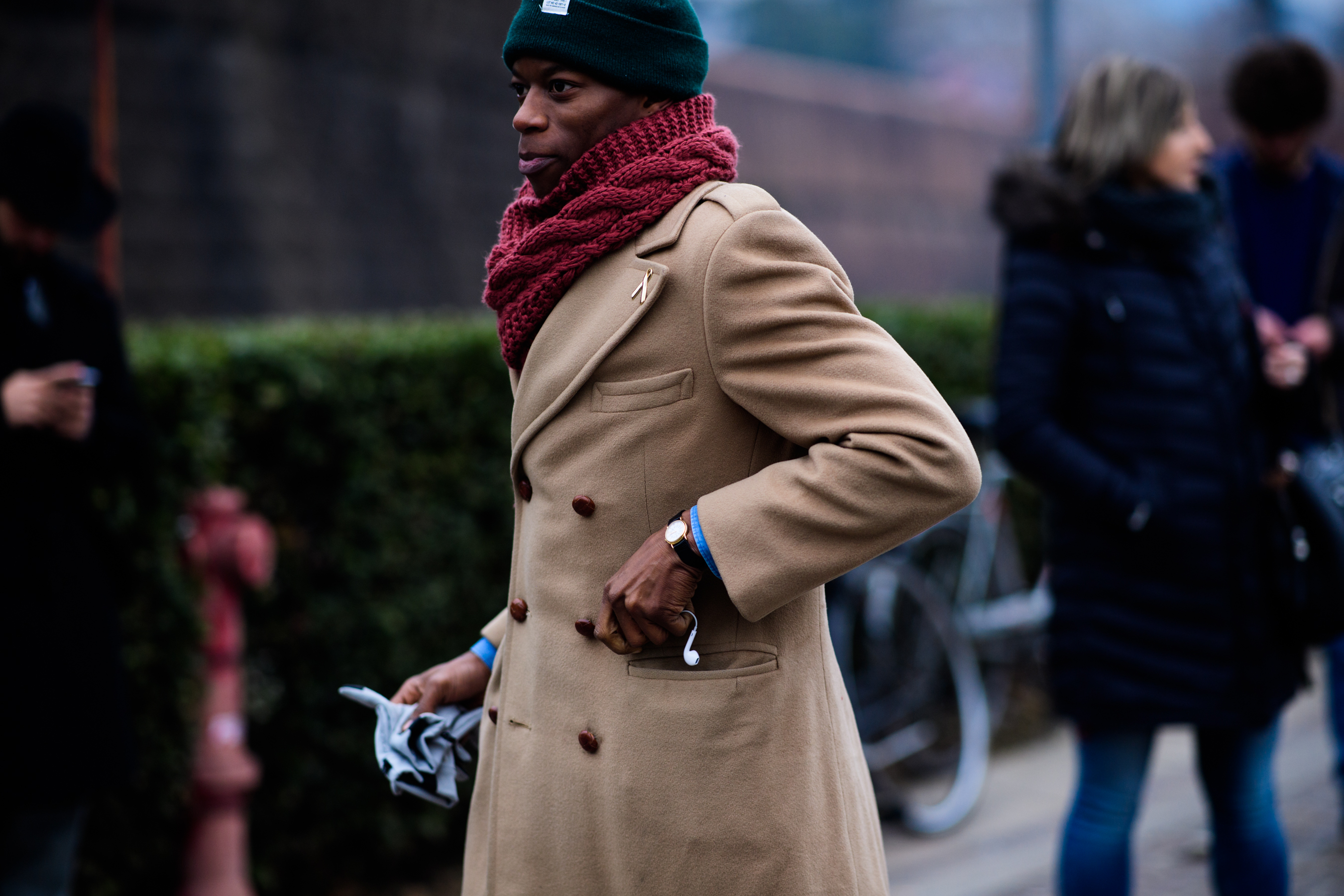 African man wearing scarf, hat, and coat