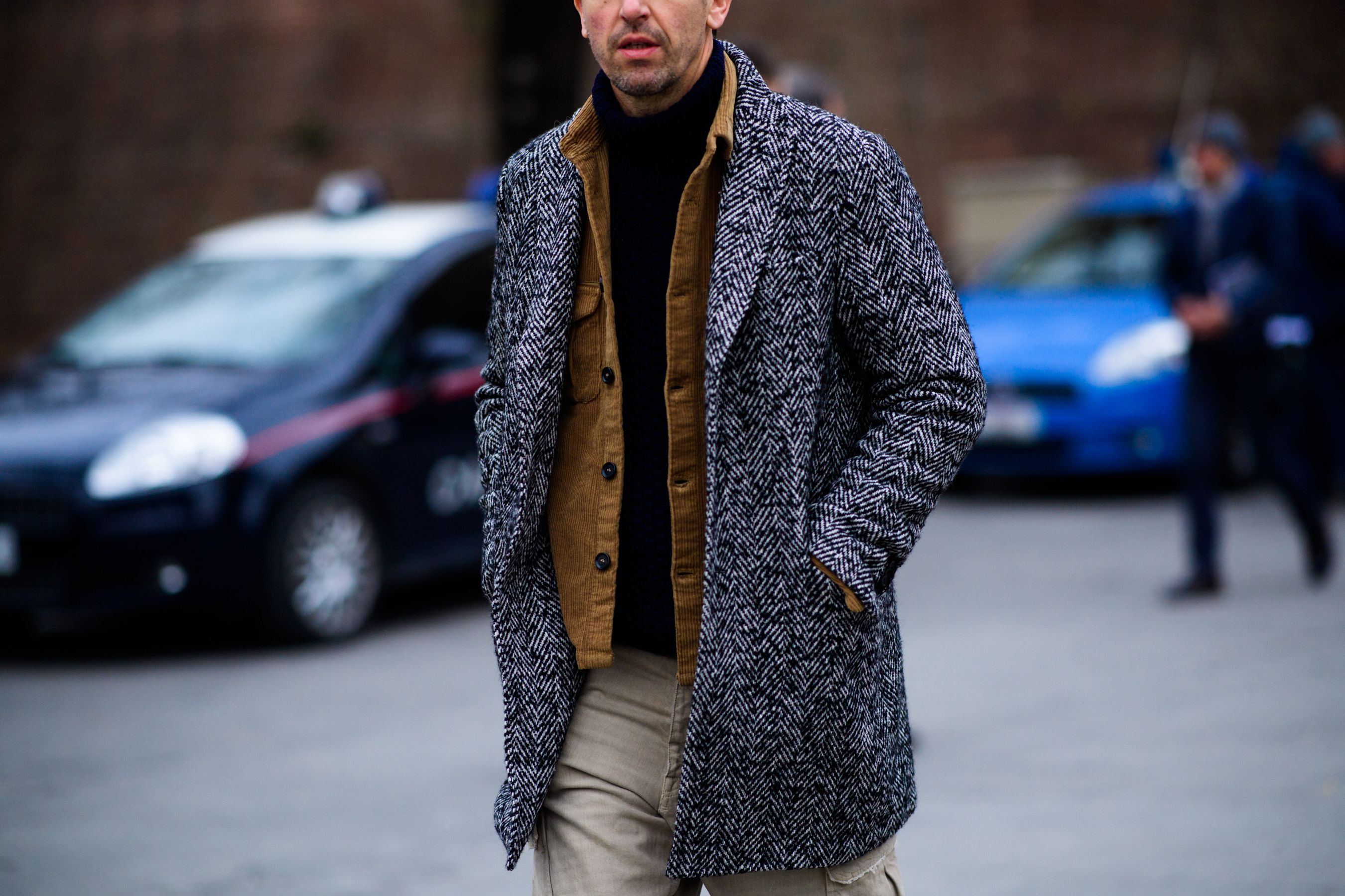 man wearing black and white coat