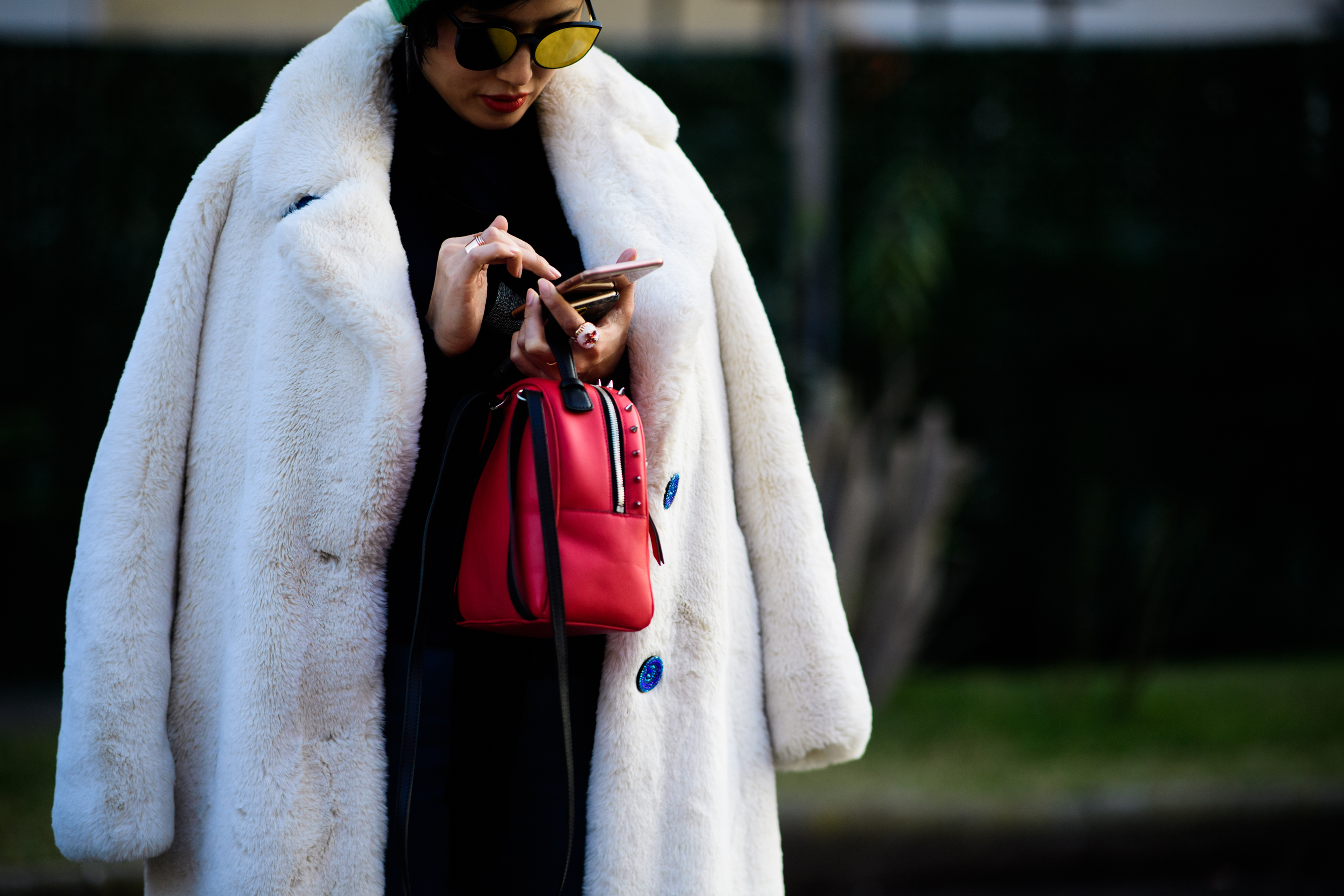 Woman wearing white fur coat