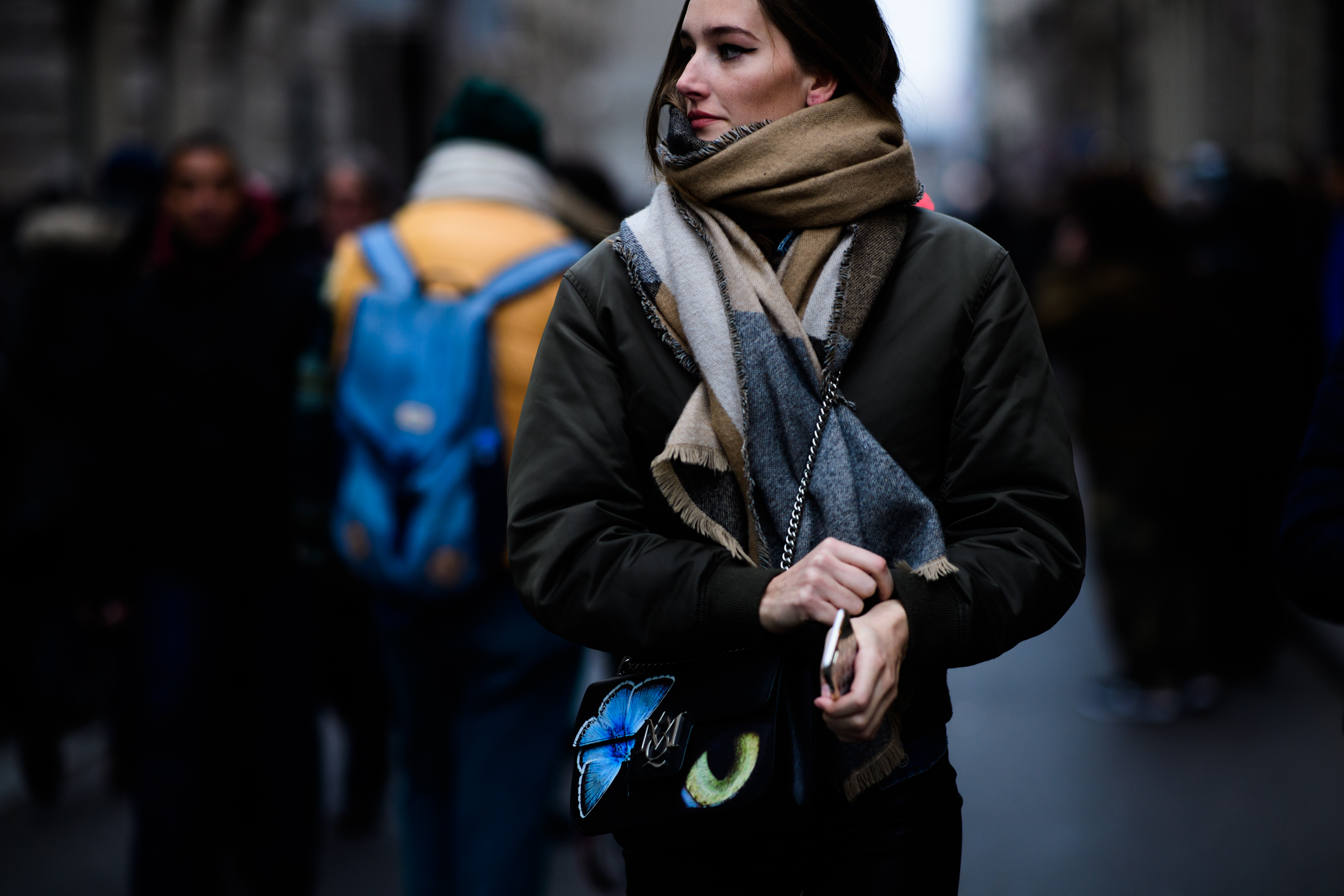 Woman wearing Alexandr McQueen handbag