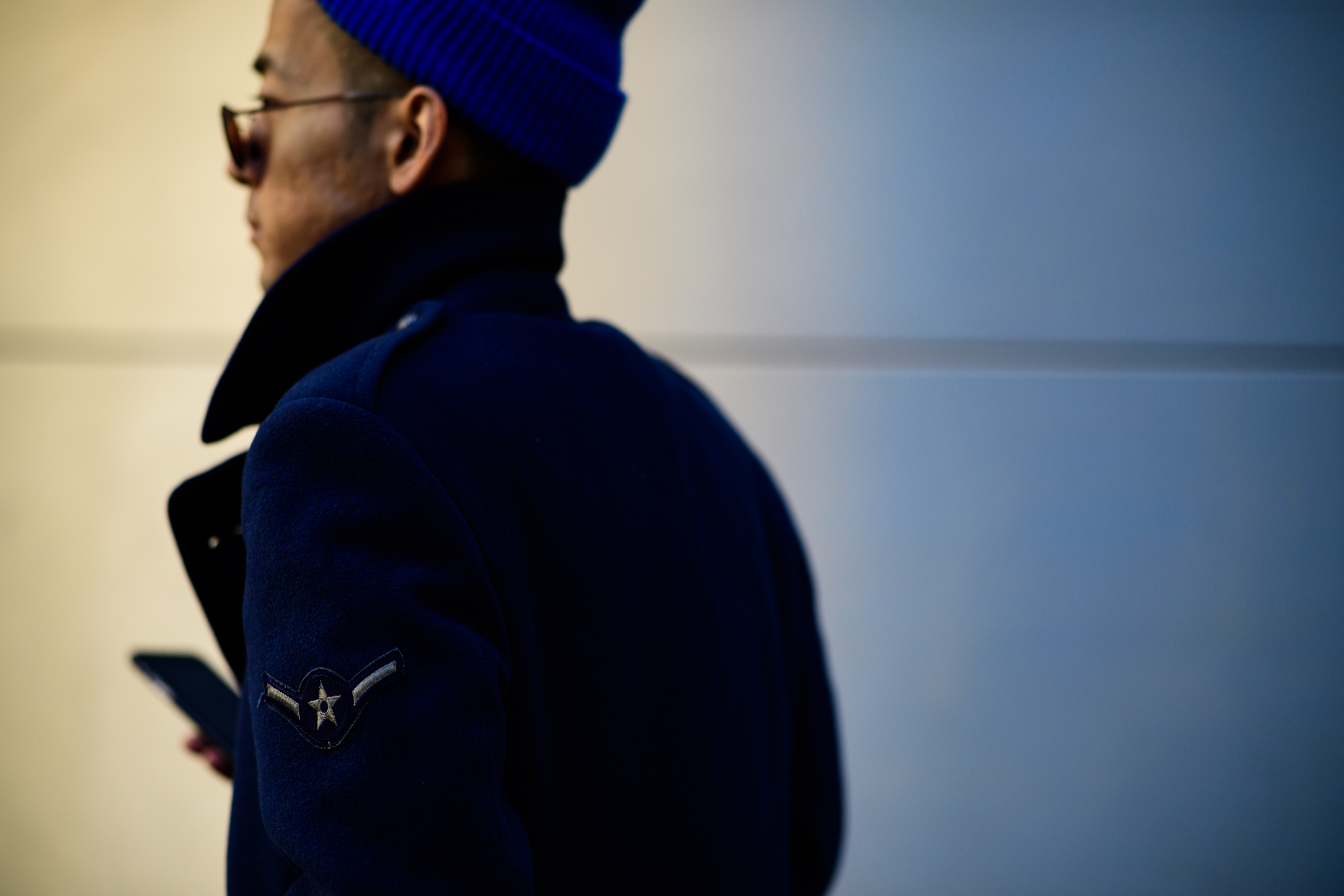 Man wearing blue hat and blue coat