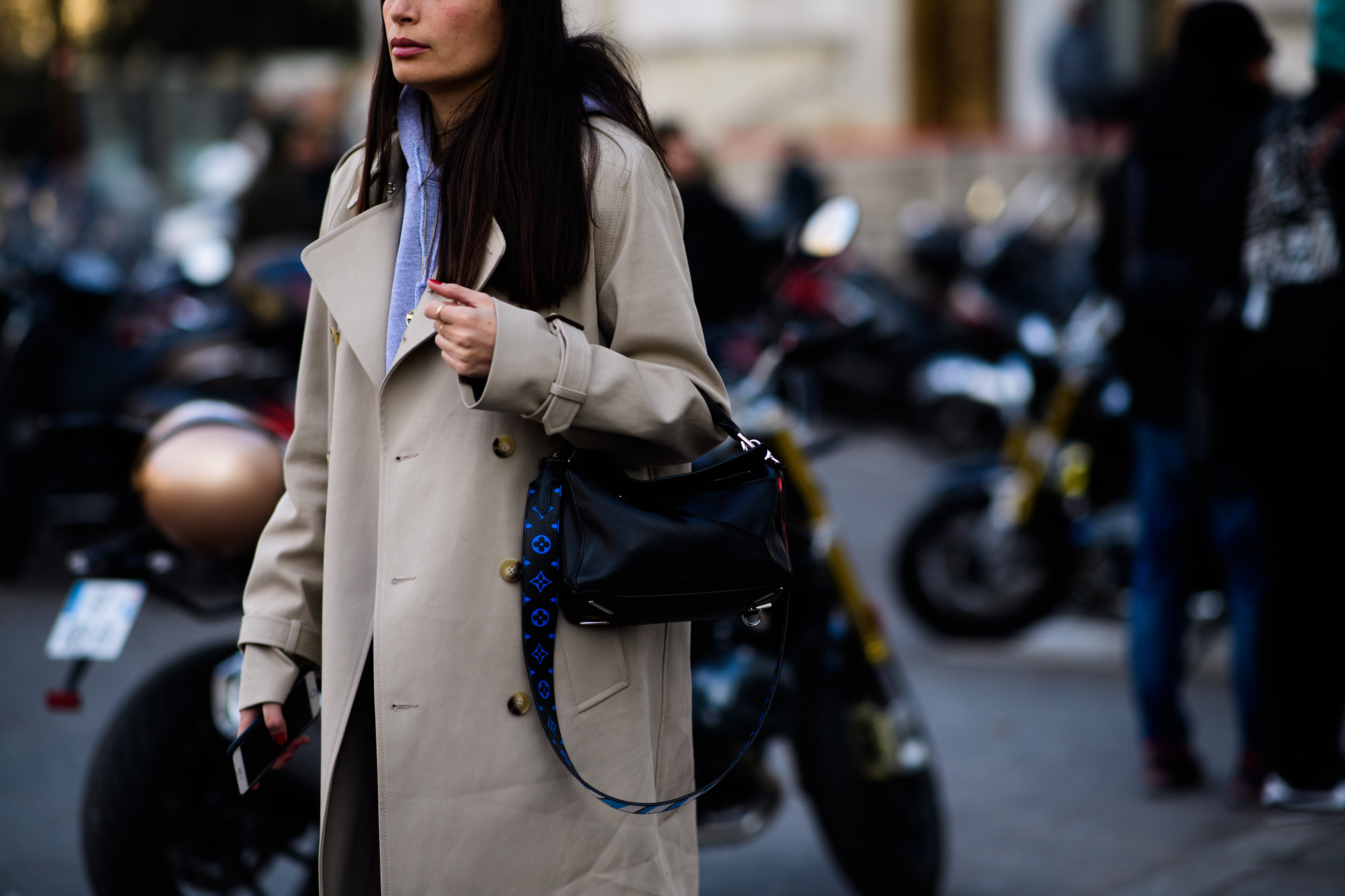 Woman wearing Louis Vuitton handbag