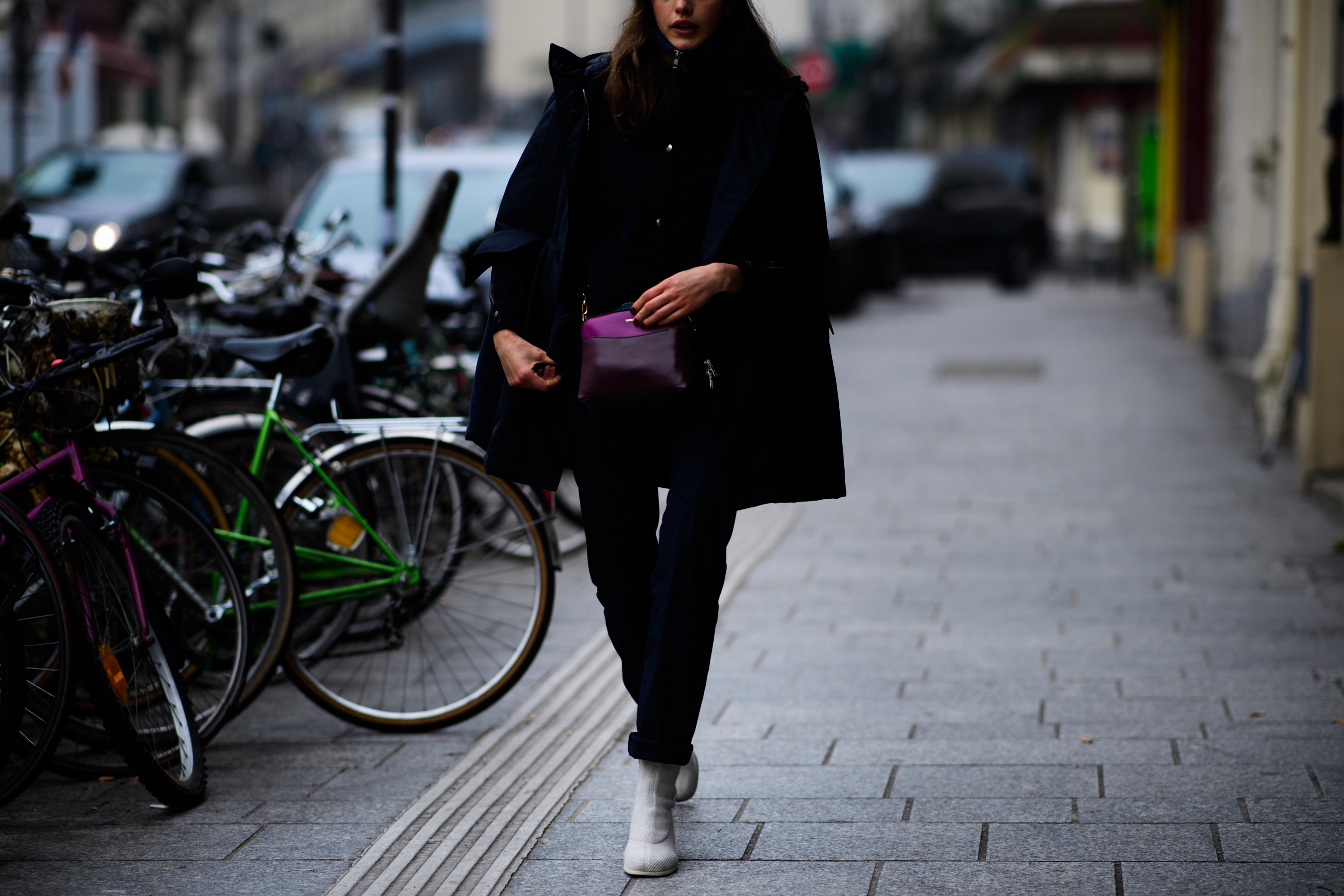 Woman wearing white shoes
