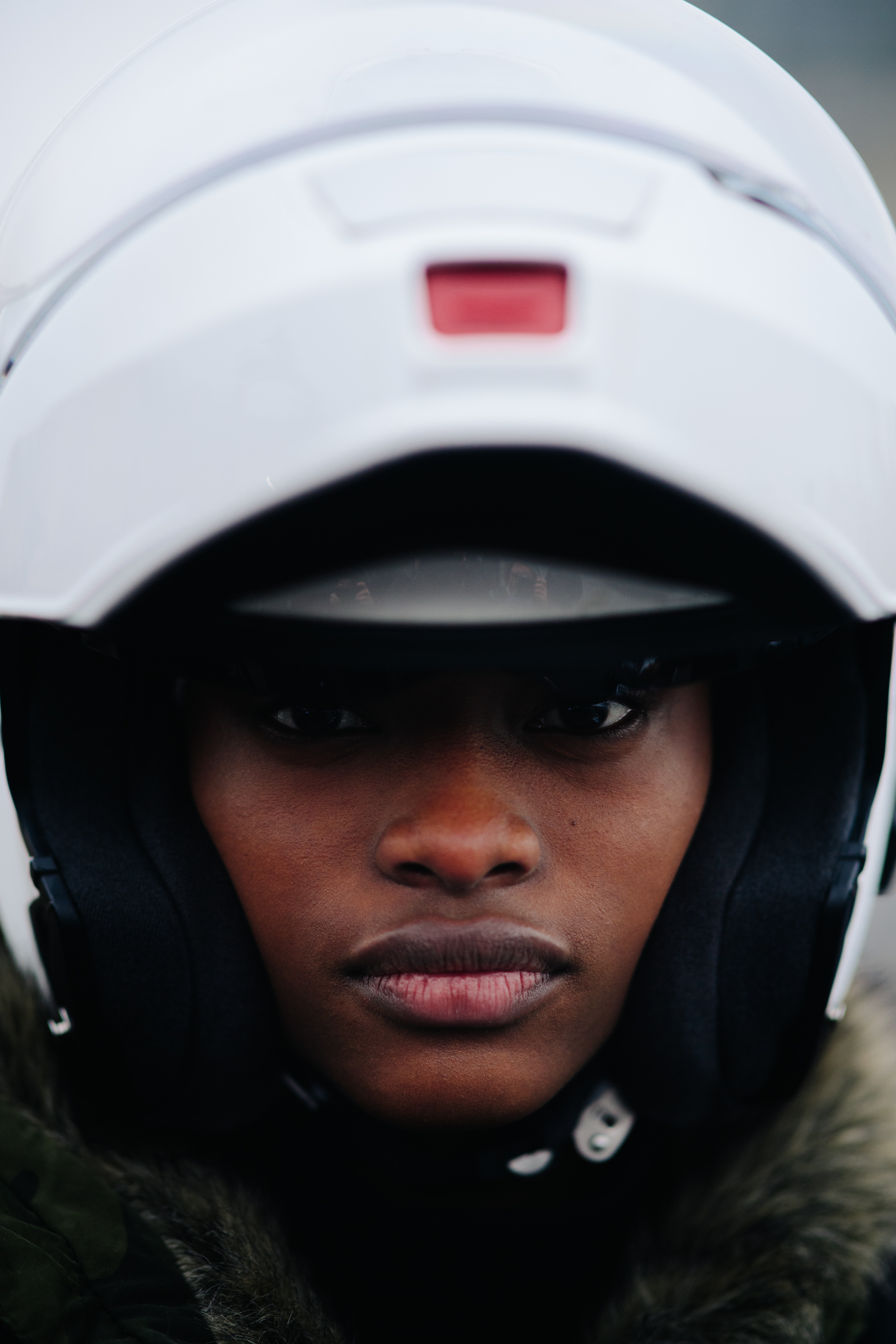 Portrait of African woman with white helmet