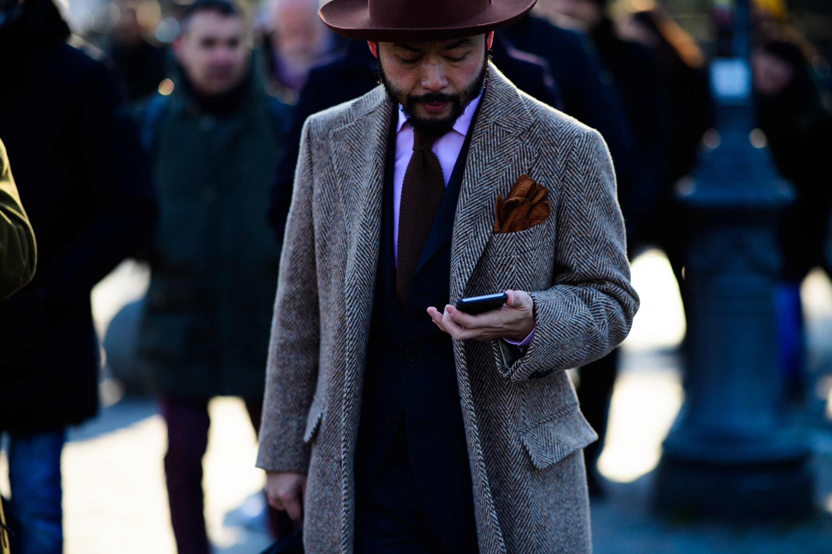 Man wearing grey coat