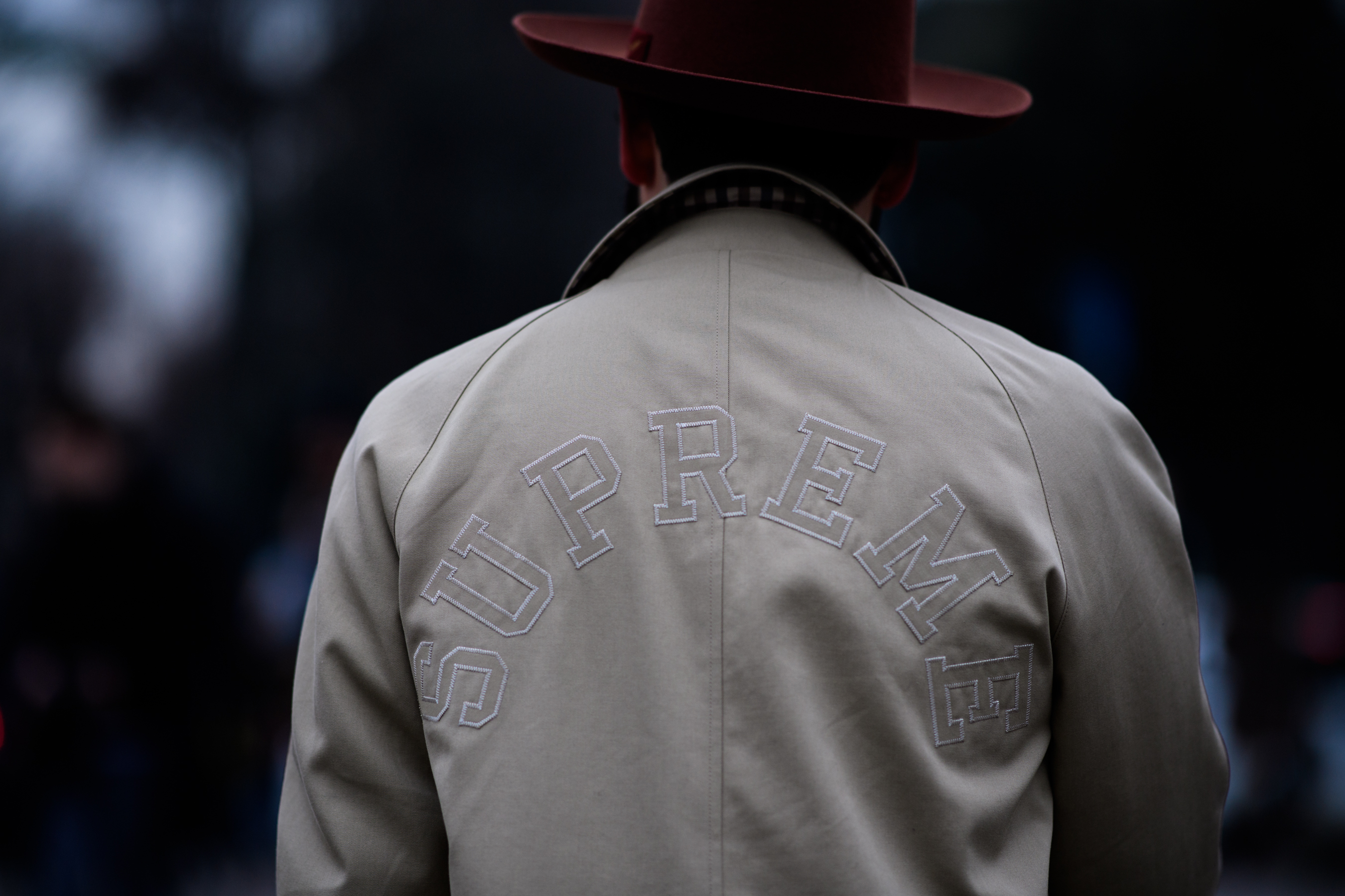 Man wearing supreme cloak