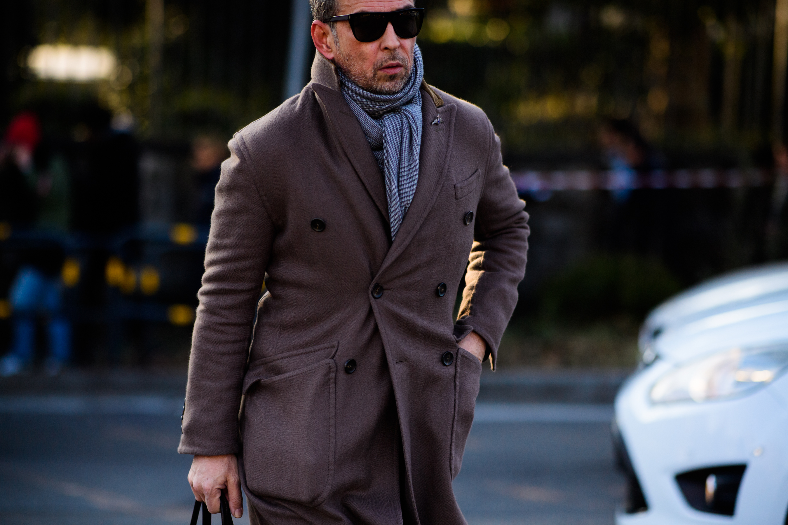 Man wearing scarf under coat