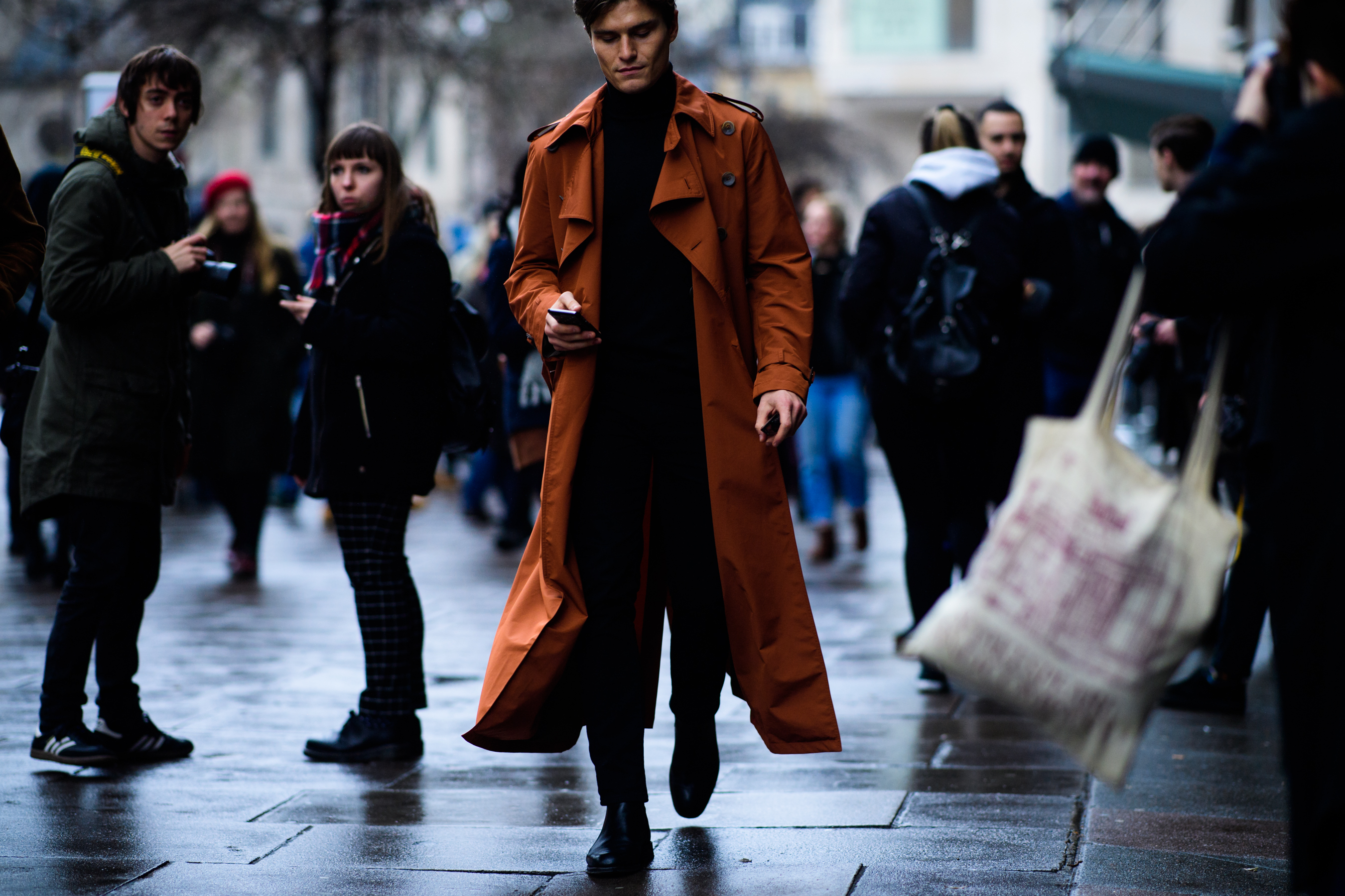 Model wearing orange cloak